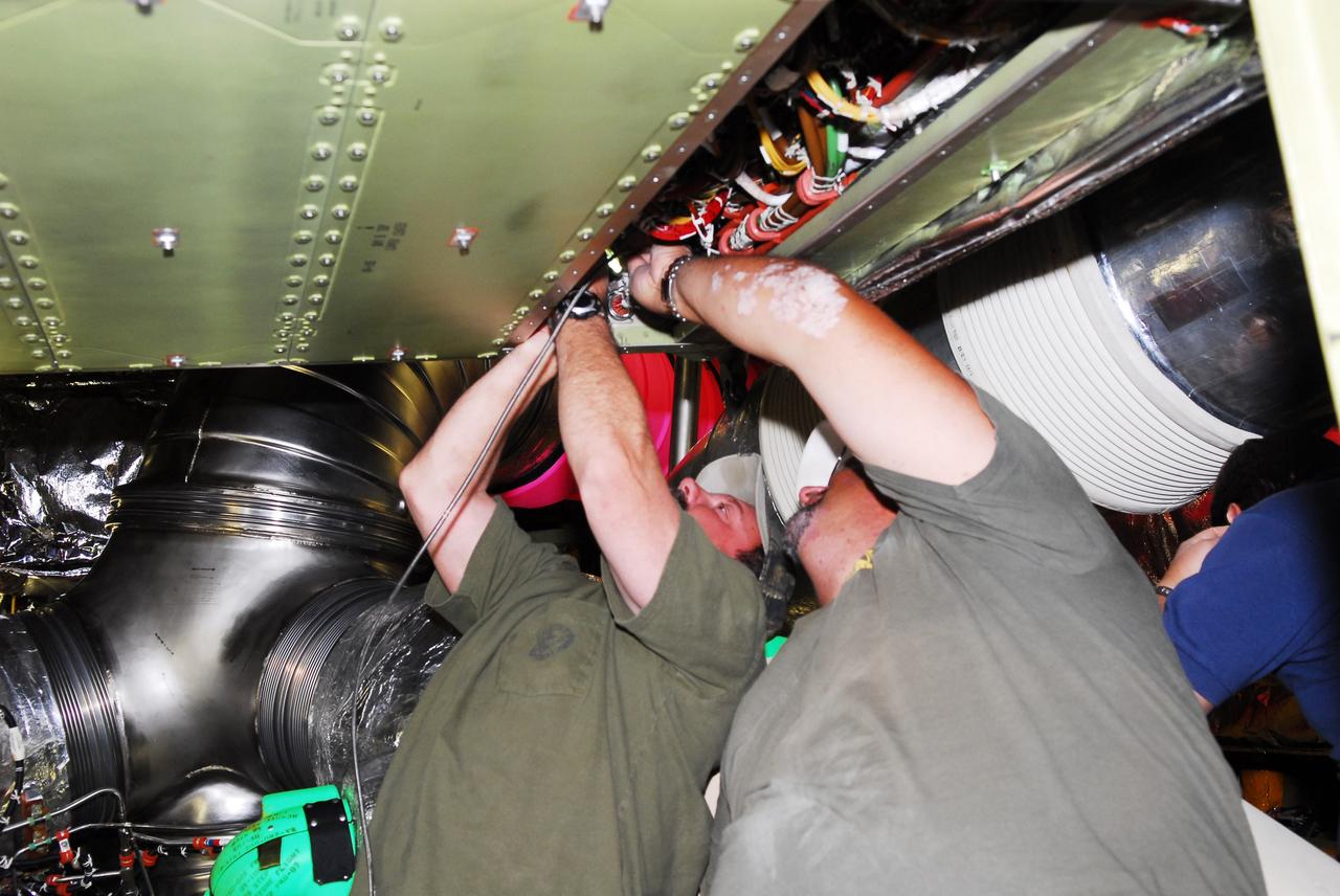 CAPE CANAVERAL, Fla. -- At NASA Kennedy Space Center's Launch Pad 39A, technicians use a borescope to inspect wiring after installing a new aft load control assembly (ALCA-2) in the aft compartment of space shuttle Endeavour. The ALCA-2, which feeds power to the fuel line heaters, caused the heaters for Endeavour's auxiliary power unit-1 (APU-1) to fail April 29 during the first launch attempt for the STS-134 mission. The assembly was replaced and systems will be retested before the next launch attempt, which now is no earlier than May 16 at 8:56 a.m. EDT.    STS-134 will deliver the Express Logistics Carrier-3, Alpha Magnetic Spectrometer-2 (AMS), a high-pressure gas tank and additional spare parts for the Dextre robotic helper to the International Space Station. The mission will be the final spaceflight for Endeavour. For more information, visit www.nasa.gov/mission_pages/shuttle/shuttlemissions/sts134/index.html. Photo credit: NASA/Jim Grossmann