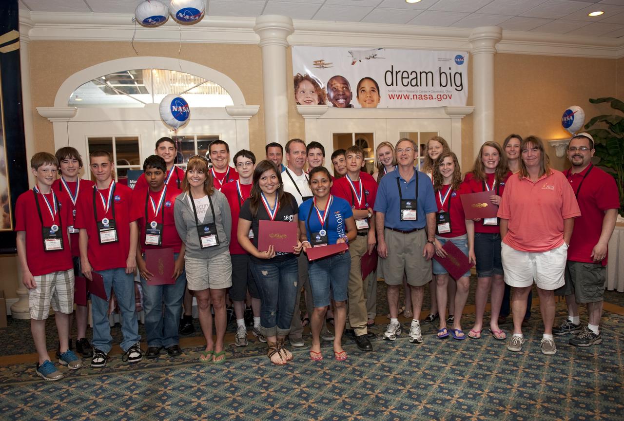 Cape Canaveral, Fla. -- Students and teachers from across the nation gathered for a photo opportunity during closing events of the NASA Explorer Schools (NES) symposium.             During the NES gathering, students presented their investigation project to their peers, scientists, engineers and education specialists. About 60 fourth- through 12-grade students nationwide are at the center May 4-7 participating in tours of processing and launch facilities and the U.S. Astronaut Hall of Fame, as well as several educational activities and a career panel question-and-answer session. About 30 teachers will receive professional development opportunities during the symposium. The participants were competitively selected after they completed an original investigation focused on existing NASA missions or research interests. Photo Credit: NASA/Kim Shiflett