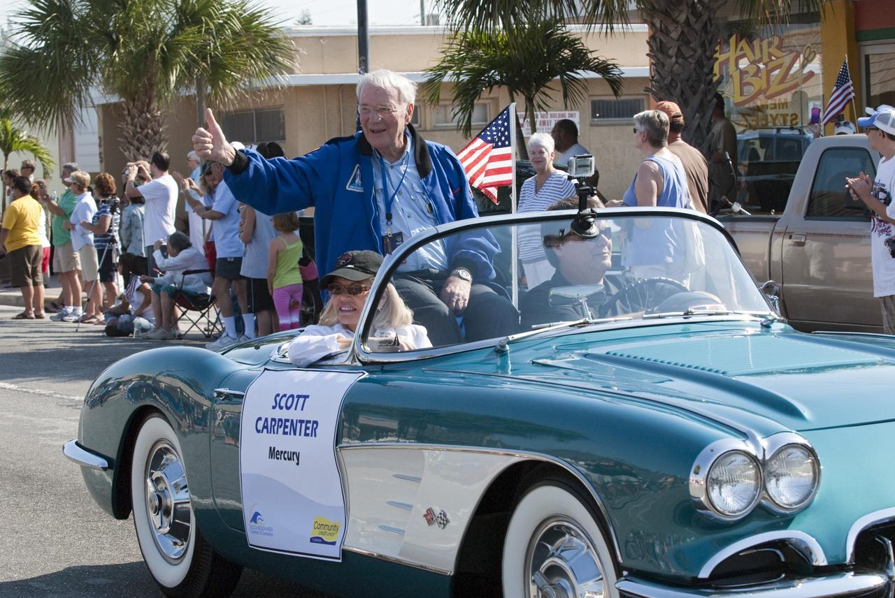 Cape Canaveral, Fla. – Retired Mercury 7 astronaut Scott Carpenter waves to spectators from a vintage Chevrolet Corvette during a commemorative parade in Cocoa Beach, Fla. A group of current and retired NASA astronauts gathered in Cocoa Beach to commemorate NASA’s 50 years of accomplishments and to honor astronaut Alan Shepard’s Mercury/Freedom 7 suborbital flight May 5, 1961.The event was marked by a parade, with the astronauts riding in a fleet of Chevrolet Corvettes that corresponded with the time period of their space missions. Members of the Cape Kennedy Corvette Club, a group established in 1967, escorted almost two dozen astronauts or their family representatives in club members' cars. The Corvette parade started at the glass bank building, at 9:34 a.m. EDT, the same time Shepard launched into space. Photo credit: NASA/Kim Shiflett