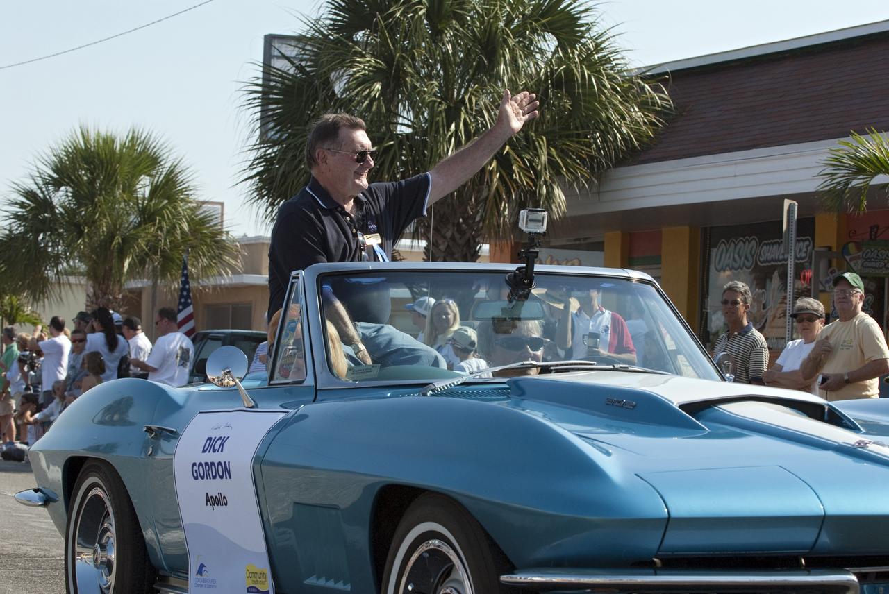Cape Canaveral, Fla. -- Retired Gemini and Apollo astronaut Dick Gordon waves to spectators from a vintage Chevrolet Corvette during a commemorative parade in Cocoa Beach, Fla. A group of current and retired NASA astronauts gathered in Cocoa Beach to commemorate NASA’s 50 years of accomplishments and to honor astronaut Alan Shepard’s Mercury/Freedom 7 suborbital flight May 5, 1961.The event was marked by a parade, with the astronauts riding in a fleet of Chevrolet Corvettes that corresponded with the time period of their space missions. Members of the Cape Kennedy Corvette Club, a group established in 1967, escorted almost two dozen astronauts or their family representatives in club members' cars. The Corvette parade started at the glass bank building, at 9:34 a.m. EDT, the same time Shepard launched into space. Photo credit: NASA/Kim Shiflett
