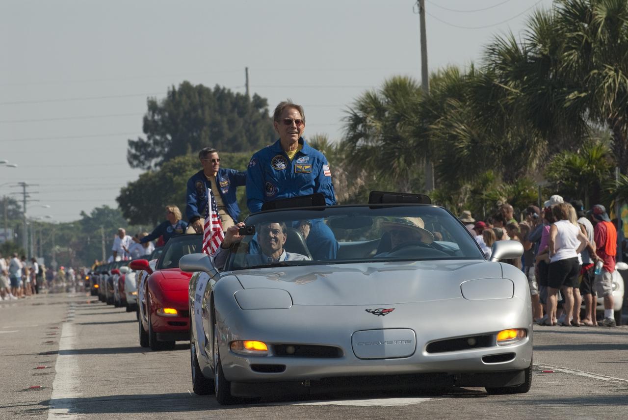 Cape Canaveral, Fla. -- Retired space shuttle astronaut Sam Durrance greets spectators from a Chevrolet Corvette during a commemorative parade in Cocoa Beach, Fla. A group of current and retired NASA astronauts gathered in Cocoa Beach to commemorate NASA’s 50 years of accomplishments and to honor astronaut Alan Shepard’s Mercury/Freedom 7 suborbital flight May 5, 1961.The event was marked by a parade, with the astronauts riding in a fleet of Chevrolet Corvettes that corresponded with the time period of their space missions. Members of the Cape Kennedy Corvette Club, a group established in 1967, escorted almost two dozen astronauts or their family representatives in club members' cars. The Corvette parade started at the glass bank building, at 9:34 a.m. EDT, the same time Shepard launched into space. Photo credit: NASA/Kim Shiflett