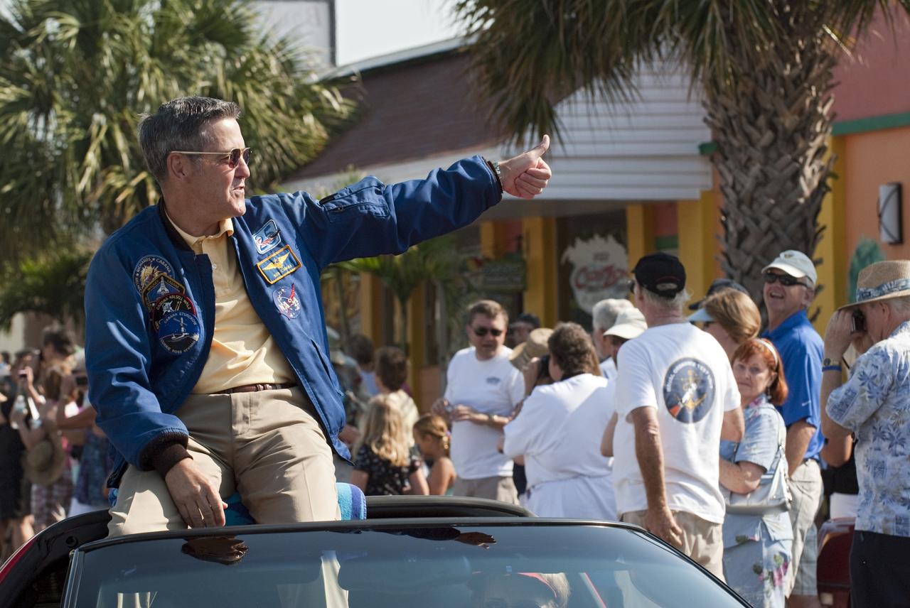 Cape Canaveral, Fla. -- Kennedy Space Center Director and former space shuttle astronaut Bob Cabana gives a thumbs-up to spectators from a Chevrolet Corvette during a commemorative parade in Cocoa Beach, Fla. A group of current and retired NASA astronauts gathered in Cocoa Beach to commemorate NASA’s 50 years of accomplishments and to honor astronaut Alan Shepard’s Mercury/Freedom 7 suborbital flight May 5, 1961.The event was marked by a parade, with the astronauts riding in a fleet of Chevrolet Corvettes that corresponded with the time period of their space missions. Members of the Cape Kennedy Corvette Club, a group established in 1967, escorted almost two dozen astronauts or their family representatives in club members' cars. The Corvette parade started at the glass bank building, at 9:34 a.m. EDT, the same time Shepard launched into space. Photo credit: NASA/Kim Shiflett