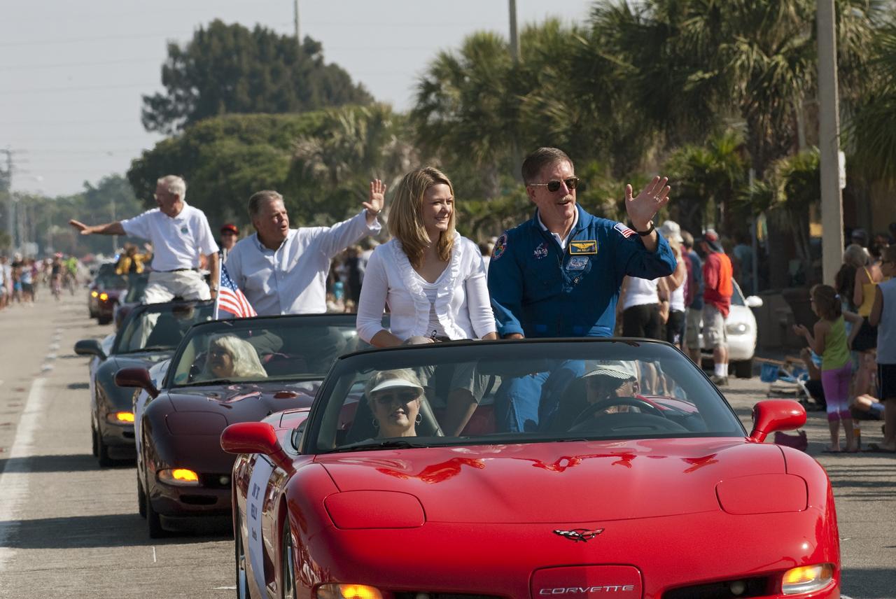 Cape Canaveral, Fla. -- Retired space shuttle astronaut James Reilly waves to spectators from a vintage Chevrolet Corvette during a commemorative parade in Cocoa Beach, Fla. A group of current and retired NASA astronauts gathered in Cocoa Beach to commemorate NASA’s 50 years of accomplishments and to honor astronaut Alan Shepard’s Mercury/Freedom 7 suborbital flight May 5, 1961.The event was marked by a parade, with the astronauts riding in a fleet of Chevrolet Corvettes that corresponded with the time period of their space missions. Members of the Cape Kennedy Corvette Club, a group established in 1967, escorted almost two dozen astronauts or their family representatives in club members' cars. The Corvette parade started at the glass bank building, at 9:34 a.m. EDT, the same time Shepard launched into space. Photo credit: NASA/Kim Shiflett