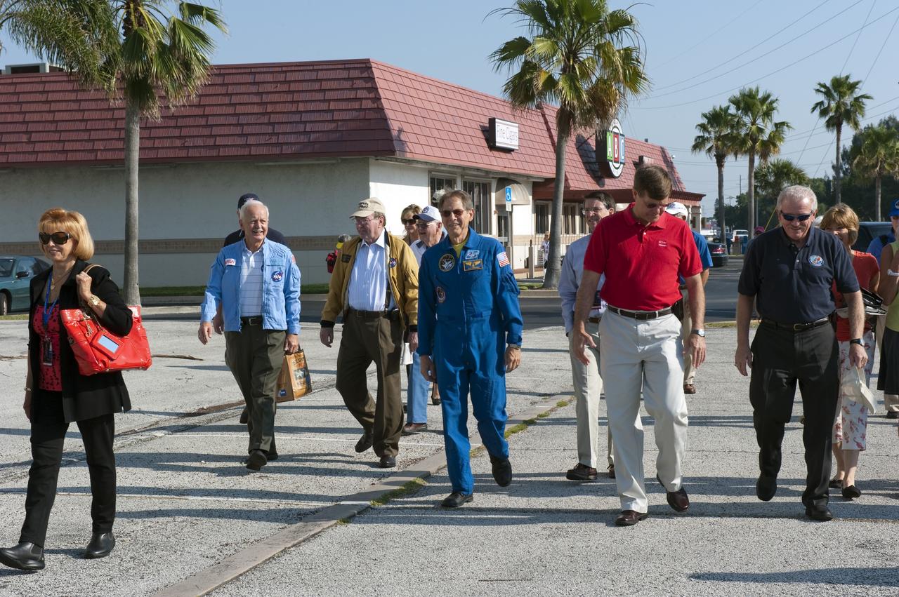Cape Canaveral, Fla. -- Guests and retired astronauts walk away from the Chevrolet Corvettes they rode in during a commemorative parade in Cocoa Beach, Florida. A group of current and retired NASA astronauts gathered in Cocoa Beach to commemorate NASA’s 50 years of accomplishments and to honor astronaut Alan Shepard’s Mercury/Freedom 7 suborbital flight May 5, 1961.The event was marked by a parade, with the astronauts riding in a fleet of Chevrolet Corvettes that corresponded with the time period of their space missions. Members of the Cape Kennedy Corvette Club, a group established in 1967, escorted almost two dozen astronauts or their family representatives in club members' cars. The Corvette parade started at the glass bank building, at 9:34 a.m. EDT, the same time Shepard launched into space. Photo credit: NASA/Kim Shiflett