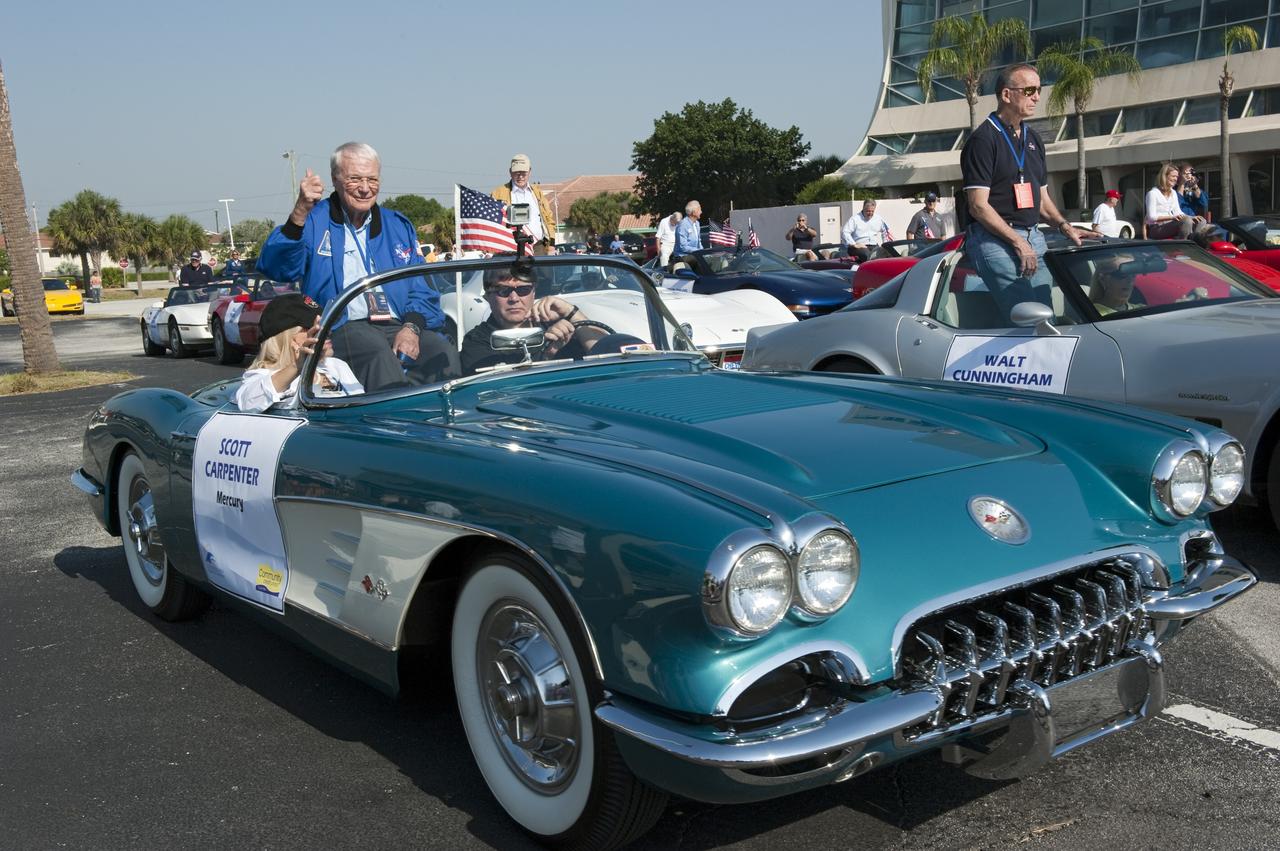 Cape Canaveral, Fla. -- Retired Mercury 7 astronaut Scott Carpenter gives a thumbs-up to spectators from a Chevrolet Corvette after a commemorative parade in Cocoa Beach, Florida. A group of current and retired NASA astronauts gathered in Cocoa Beach to commemorate NASA’s 50 years of accomplishments and to honor astronaut Alan Shepard’s Mercury/Freedom 7 suborbital flight May 5, 1961.The event was marked by a parade, with the astronauts riding in a fleet of Chevrolet Corvettes that corresponded with the time period of their space missions. Members of the Cape Kennedy Corvette Club, a group established in 1967, escorted almost two dozen astronauts or their family representatives in club members' cars. The Corvette parade started at the glass bank building, at 9:34 a.m. EDT, the same time Shepard launched into space. Photo credit: NASA/Kim Shiflett