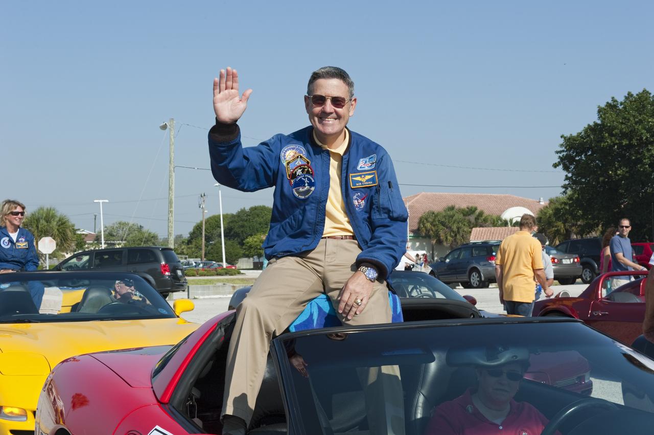Cape Canaveral, Fla. -- Kennedy Space Center Director and former space shuttle astronaut Bob Cabana waves to spectators from a Chevrolet Corvette after a commemorative parade in Cocoa Beach, Florida. A group of current and retired NASA astronauts gathered in Cocoa Beach to commemorate NASA’s 50 years of accomplishments and to honor astronaut Alan Shepard’s Mercury/Freedom 7 suborbital flight May 5, 1961.The event was marked by a parade, with the astronauts riding in a fleet of Chevrolet Corvettes that corresponded with the time period of their space missions. Members of the Cape Kennedy Corvette Club, a group established in 1967, escorted almost two dozen astronauts or their family representatives in club members' cars. The Corvette parade started at the glass bank building, at 9:34 a.m. EDT, the same time Shepard launched into space. Photo credit: NASA/Kim Shiflett