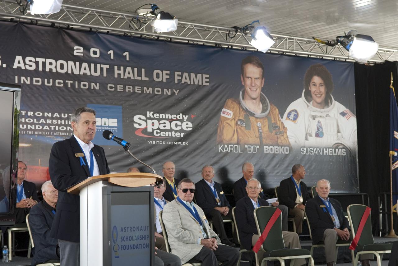 Cape Canaveral, Fla. -- Hall of Fame astronaut and present Kennedy Center Director Bob Cabana addresses the spectators at the 2011 U.S. Astronaut Hall of Fame ceremony held at NASA's Kennedy Space Center Visitor Complex in Florida.       Hall of Fame astronauts and visitors gathered to honor 2011 inductees Karol "Bo" Bobko and Susan Helms. During his 19 years in the astronaut program, Bobko flew on three space shuttle missions and logged more than 386 hours in space. He served as pilot during the first voyage of space shuttle Challenger aboard STS-6 in April 1983 and as commander during the maiden flight of space shuttle Atlantis aboard STS-51J in October 1985. Helms, a five-time space shuttle astronaut, has logged 5,064 hours in space. During her stay onboard the International Space Station as a member of the Expedition-2 crew in 2001, Helms performed a world record 8 hour and 56 minute spacewalk. Bobko and Helms join the ranks of the U.S. Astronaut Hall of Fame bringing the number of space explorers enshrined in the Hall of Fame to 79. Photo Credit: NASA/Jim Grossmann