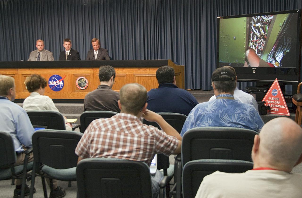 CAPE CANAVERAL, Fla. -- In the Press Site auditorium at NASA's Kennedy Space Center in Florida, NASA managers brief media about the launch status of space shuttle Endeavour's STS-134 mission and announce a new launch date. From left are NASA News Chief Allard Beutel, Space Shuttle Program Launch Integration Manager, Mike Moses and Shuttle Launch Director Mike Leinbach.        Technicians replaced and tested the aft load control assembly-2 (ALCA-2) and wiring located in Endeavour's aft avionics bay 5. ALCA-2 distributes power to nine shuttle systems and is believed to have caused fuel line heaters for Endeavour's auxiliary power unit-1 (APU-1) to fail April 29 during the first launch attempt. Launch now is scheduled for May 16 at 8:56 a.m. EDT. Endeavour and its crew will deliver the Express Logistics Carrier-3, Alpha Magnetic Spectrometer-2 (AMS), a high-pressure gas tank and additional spare parts for the Dextre robotic helper to the station. This will be the final spaceflight for Endeavour. For more information visit, www.nasa.gov/mission_pages/shuttle/shuttlemissions/sts134/index.html. Photo credit: NASA/Jack Pfaller