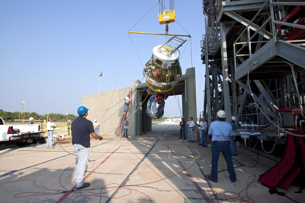 CAPE CANAVERAL, Fla. -- At NASA's Space Launch Complex 17B in Florida, workers using an overhead crane hoist the second stage of a United Launch Alliance Delta II launch vehicle toward the first stage for mating. The payload fairing then will be raised into the white room of the mobile service tower. The Delta II will carry NASA's Gravity Recovery and Interior Laboratory, or GRAIL, spacecraft into lunar orbit. The GRAIL mission is a part of NASA's Discovery Program. GRAIL will fly twin spacecraft in tandem orbits around the moon for several months to measure its gravity field. The mission also will answer longstanding questions about Earth's moon and provide scientists a better understanding of how Earth and other rocky planets in the solar system formed. GRAIL is scheduled to launch Sept. 8. For more information visit: http://science.nasa.gov/missions/grail/. Photo credit: NASA/Jack Pfaller