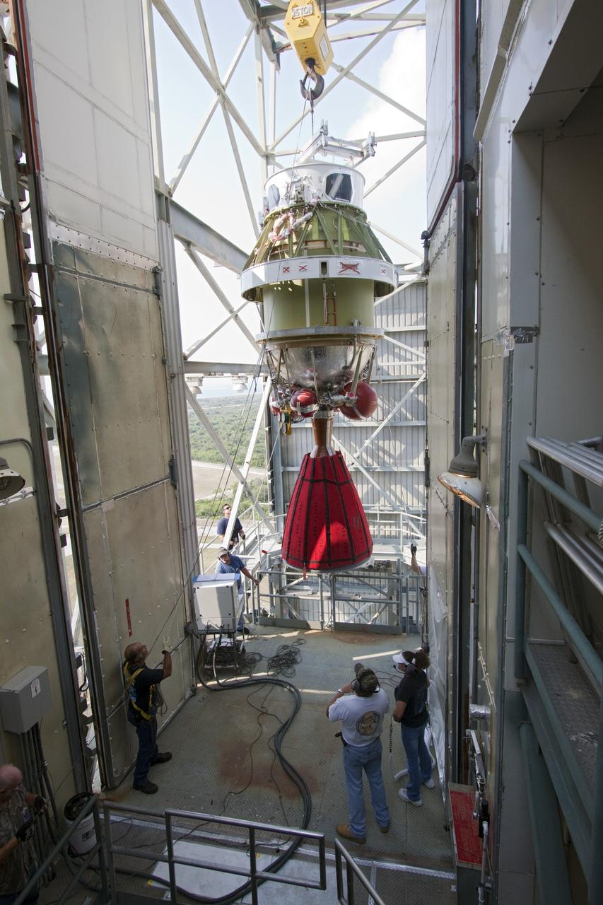 CAPE CANAVERAL, Fla. -- At NASA's Space Launch Complex 17B in Florida, workers using an overhead crane guide the second stage of a United Launch Alliance Delta II launch vehicle into the tower to be mated with the first stage. The payload fairing then will be raised into the white room of the mobile service tower. The Delta II will carry NASA's Gravity Recovery and Interior Laboratory, or GRAIL, spacecraft into lunar orbit. The GRAIL mission is a part of NASA's Discovery Program. GRAIL will fly twin spacecraft in tandem orbits around the moon for several months to measure its gravity field. The mission also will answer longstanding questions about Earth's moon and provide scientists a better understanding of how Earth and other rocky planets in the solar system formed. GRAIL is scheduled to launch Sept. 8. For more information visit: http://science.nasa.gov/missions/grail/. Photo credit: NASA/Jack Pfaller
