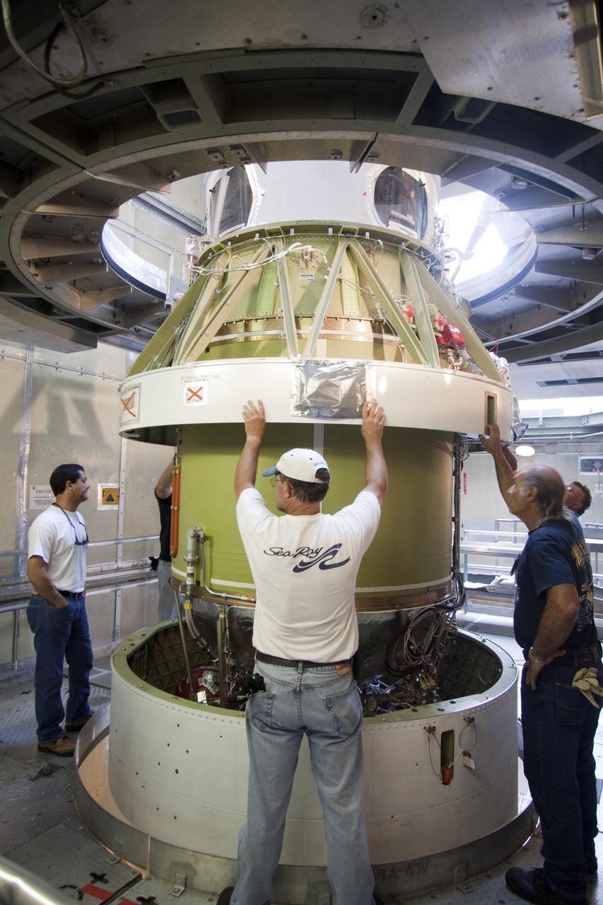 CAPE CANAVERAL, Fla. -- At NASA's Space Launch Complex 17B in Florida, workers lower the second stage of a United Launch Alliance Delta II launch vehicle toward the first stage for mating. The payload fairing then will be raised into the white room of the mobile service tower. The Delta II will carry NASA's Gravity Recovery and Interior Laboratory, or GRAIL, spacecraft into lunar orbit. The GRAIL mission is a part of NASA's Discovery Program. GRAIL will fly twin spacecraft in tandem orbits around the moon for several months to measure its gravity field. The mission also will answer longstanding questions about Earth's moon and provide scientists a better understanding of how Earth and other rocky planets in the solar system formed. GRAIL is scheduled to launch Sept. 8. For more information visit: http://science.nasa.gov/missions/grail/. Photo credit: NASA/Jack Pfaller