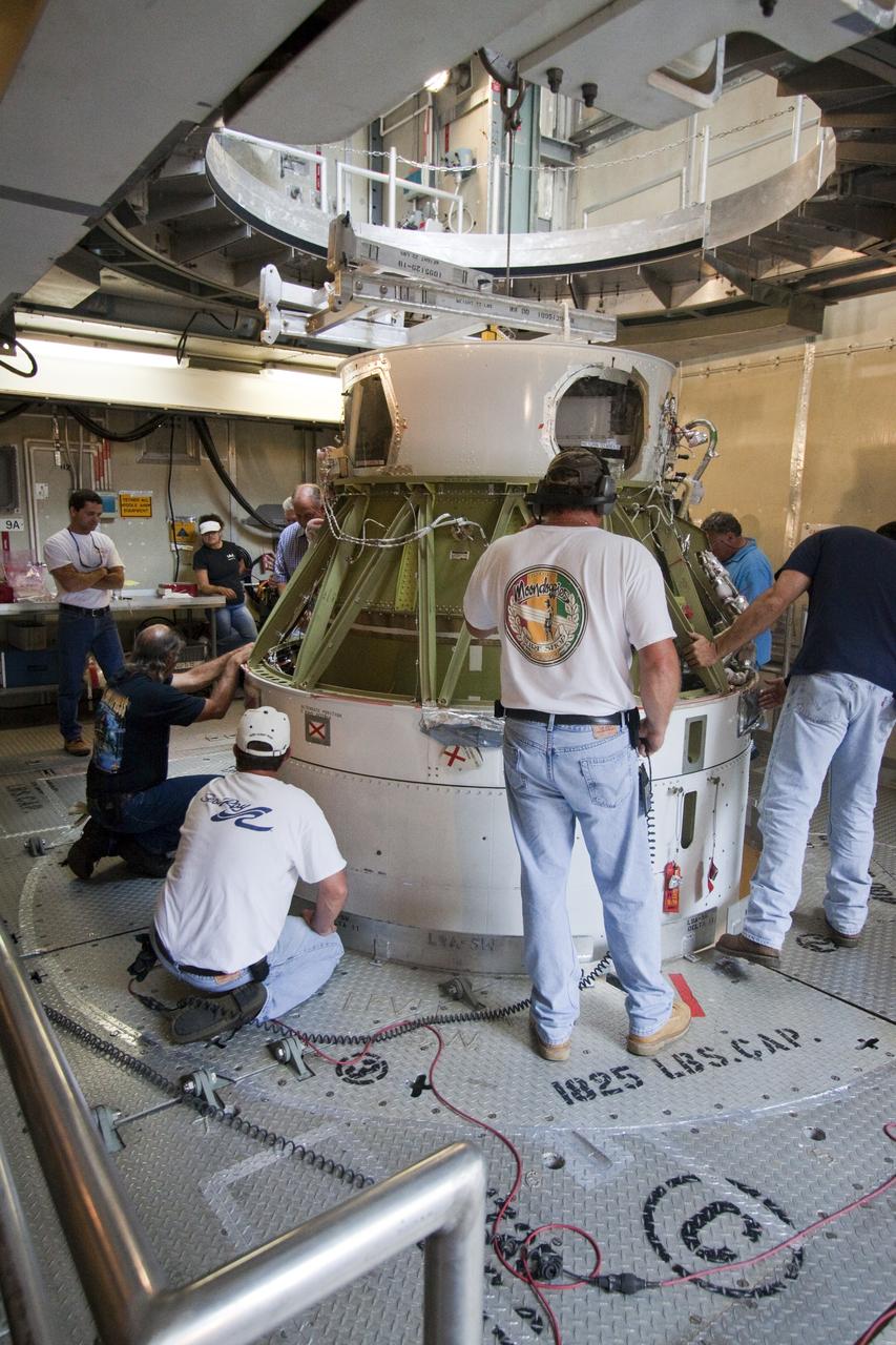 CAPE CANAVERAL, Fla. -- At NASA's Space Launch Complex 17B in Florida, workers secure the second stage of a United Launch Alliance Delta II launch vehicle to the first stage. The payload fairing then will be raised into the white room of the mobile service tower. The Delta II will carry NASA's Gravity Recovery and Interior Laboratory, or GRAIL, spacecraft into lunar orbit. The GRAIL mission is a part of NASA's Discovery Program. GRAIL will fly twin spacecraft in tandem orbits around the moon for several months to measure its gravity field. The mission also will answer longstanding questions about Earth's moon and provide scientists a better understanding of how Earth and other rocky planets in the solar system formed. GRAIL is scheduled to launch Sept. 8. For more information visit: http://science.nasa.gov/missions/grail/. Photo credit: NASA/Jack Pfaller