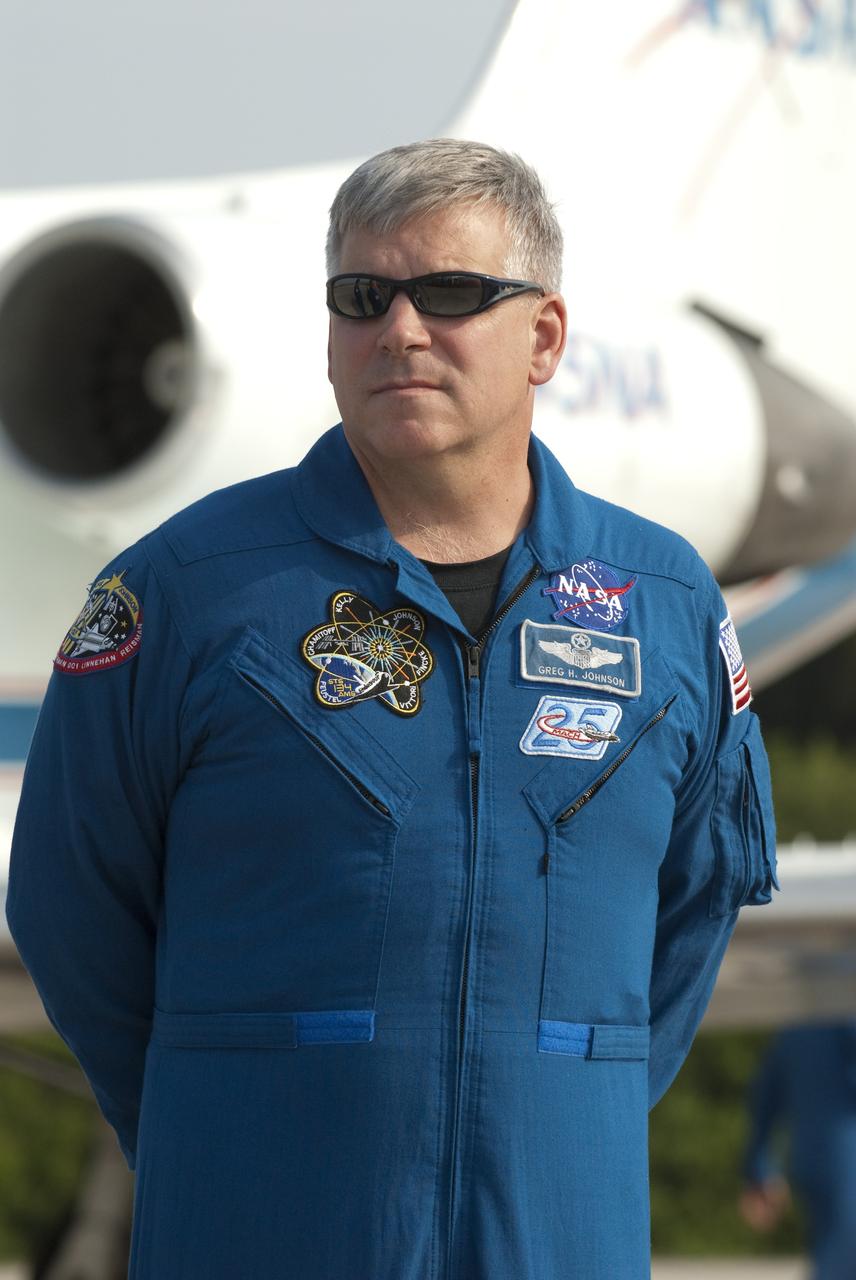 CAPE CANAVERAL, Fla. -- At the Shuttle Landing Facility at NASA's Kennedy Space Center in Florida, STS-134 Pilot Greg H. Johnson is photographed after his arrival. The STS-134 crew members landed at about 9 a.m. EDT for final preparations for Endeavour's liftoff to the International Space Station scheduled for Monday, May 16 at 8:56 a.m.      Endeavour and its crew will deliver the Express Logistics Carrier-3, Alpha Magnetic Spectrometer-2 (AMS), a high-pressure gas tank and additional spare parts for the Dextre robotic helper to the station. This will be the final spaceflight for Endeavour. For more information visit, www.nasa.gov/mission_pages/shuttle/shuttlemissions/sts134/index.html. Photo credit: NASA/Kim Shiflett