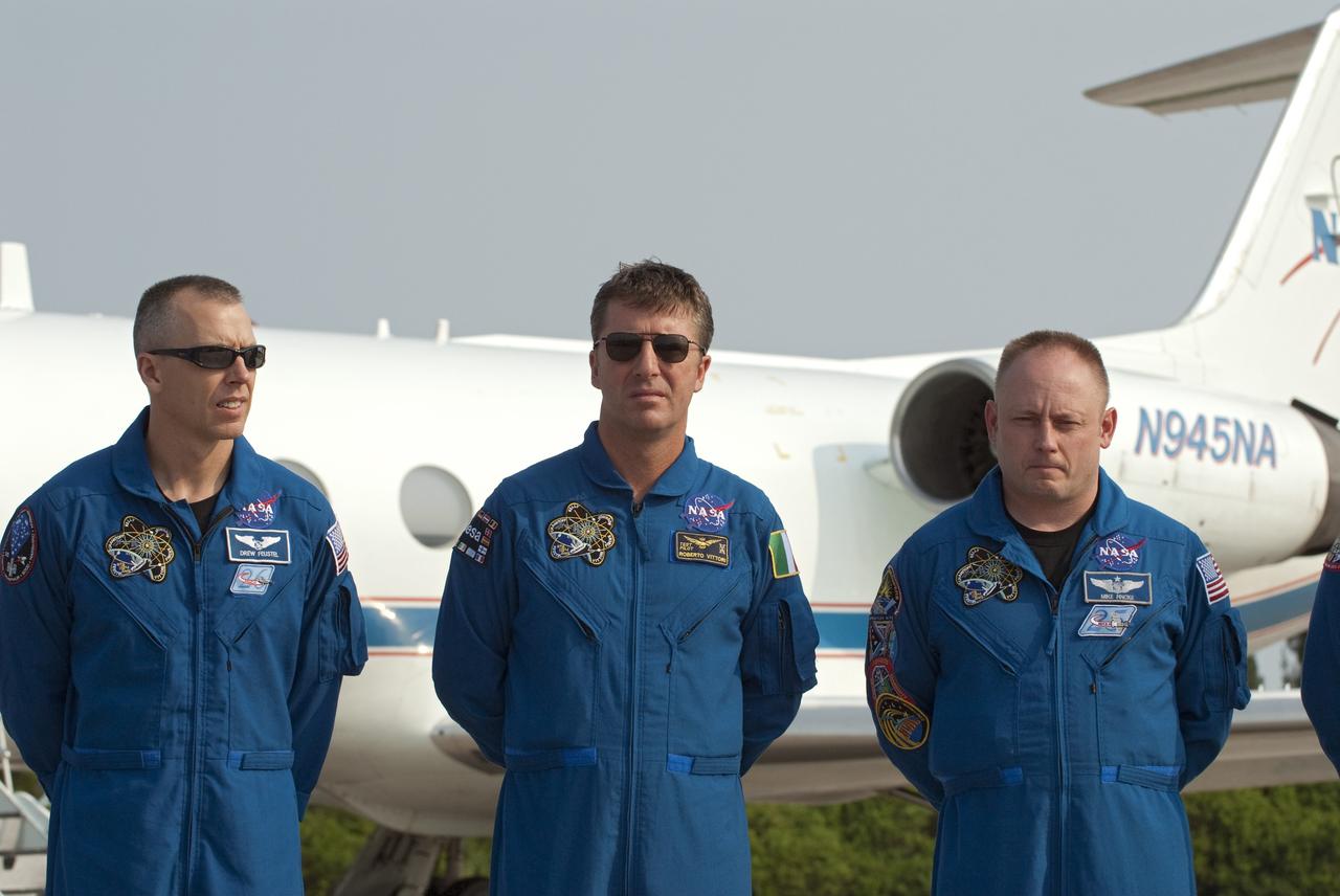 CAPE CANAVERAL, Fla. -- At the Shuttle Landing Facility at NASA's Kennedy Space Center in Florida, STS-134 Mission Specialists Andrew Feustel (left), European Space Agency astronaut Roberto Vittori and Michael Fincke are photographed after their arrival. The STS-134 crew members landed at about 9 a.m. EDT for final preparations for Endeavour's liftoff to the International Space Station scheduled for Monday, May 16 at 8:56 a.m.       Endeavour and its crew will deliver the Express Logistics Carrier-3, Alpha Magnetic Spectrometer-2 (AMS), a high-pressure gas tank and additional spare parts for the Dextre robotic helper to the station. This will be the final spaceflight for Endeavour. For more information visit, www.nasa.gov/mission_pages/shuttle/shuttlemissions/sts134/index.html. Photo credit: NASA/Kim Shiflett