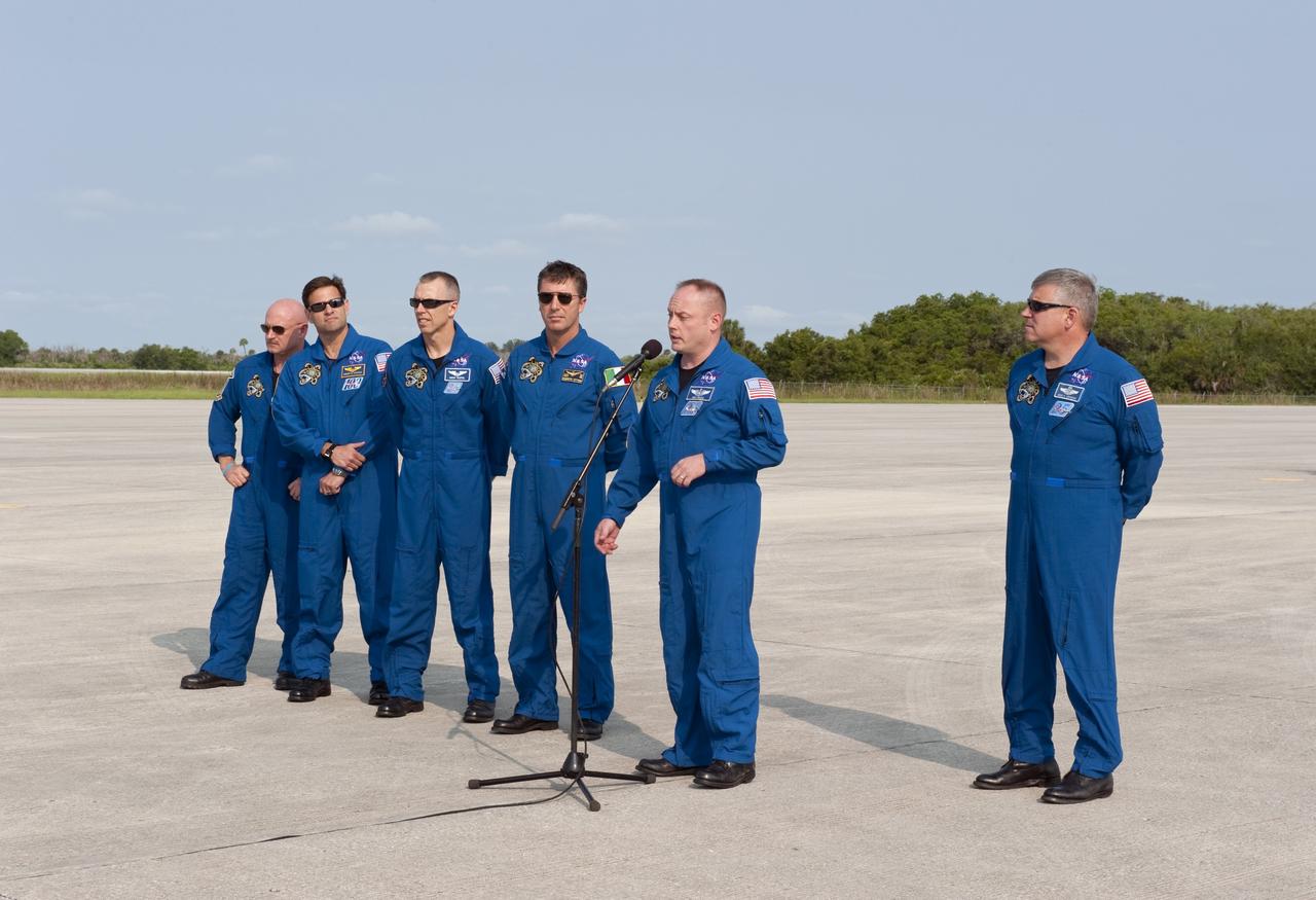 CAPE CANAVERAL, Fla. -- The STS-134 crew members arrived on the Shuttle Landing Facility at NASA's Kennedy Space Center in Florida at about 9 a.m. EDT to get ready for space shuttle Endeavour's launch to the International Space Station scheduled for Monday, May 16 at 8:56 a.m. From left are Commander Mark Kelly, Mission Specialists Greg Chamitoff, Andrew Feustel, European Space Agency astronaut Roberto Vittori, Michael Fincke, at the microphone and Pilot Greg H. Johnson.          Endeavour and its crew will deliver the Express Logistics Carrier-3, Alpha Magnetic Spectrometer-2 (AMS), a high-pressure gas tank and additional spare parts for the Dextre robotic helper to the station. This will be the final spaceflight for Endeavour. For more information visit, www.nasa.gov/mission_pages/shuttle/shuttlemissions/sts134/index.html. Photo credit: NASA/Kim Shiflett