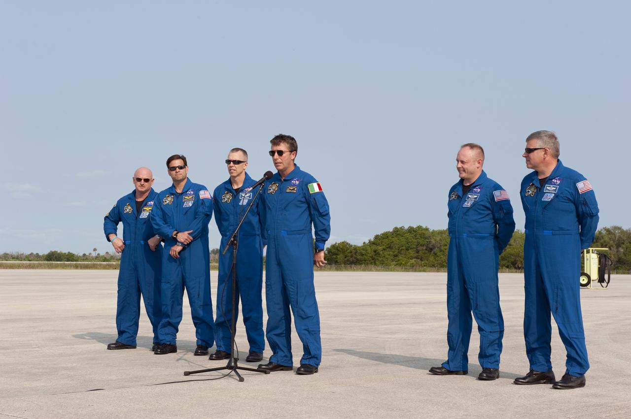 CAPE CANAVERAL, Fla. -- The STS-134 crew members arrived on the Shuttle Landing Facility at NASA's Kennedy Space Center in Florida at about 9 a.m. EDT to get ready for space shuttle Endeavour's launch to the International Space Station scheduled for Monday, May 16 at 8:56 a.m. From left are Commander Mark Kelly, Mission Specialists Greg Chamitoff, Andrew Feustel, European Space Agency astronaut Roberto Vittori, at the microphone, Michael Fincke and Pilot Greg H. Johnson.            Endeavour and its crew will deliver the Express Logistics Carrier-3, Alpha Magnetic Spectrometer-2 (AMS), a high-pressure gas tank and additional spare parts for the Dextre robotic helper to the station. This will be the final spaceflight for Endeavour. For more information visit, www.nasa.gov/mission_pages/shuttle/shuttlemissions/sts134/index.htmlPhoto credit: NASA/Kim Shiflett