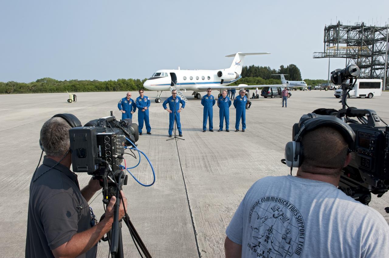 CAPE CANAVERAL, Fla. -- The STS-134 crew members arrived on the Shuttle Landing Facility at NASA's Kennedy Space Center in Florida at about 9 a.m. EDT to get ready for space shuttle Endeavour's launch to the International Space Station scheduled for Monday, May 16 at 8:56 a.m. From left are Commander Mark Kelly, Mission Specialists Greg Chamitoff, Andrew Feustel, at the microphone, European Space Agency astronaut Roberto Vittori, Michael Fincke and Pilot Greg H. Johnson.        Endeavour and its crew will deliver the Express Logistics Carrier-3, Alpha Magnetic Spectrometer-2 (AMS), a high-pressure gas tank and additional spare parts for the Dextre robotic helper to the station. This will be the final spaceflight for Endeavour. For more information visit, www.nasa.gov/mission_pages/shuttle/shuttlemissions/sts134/index.html. Photo credit: NASA/Kim Shiflett