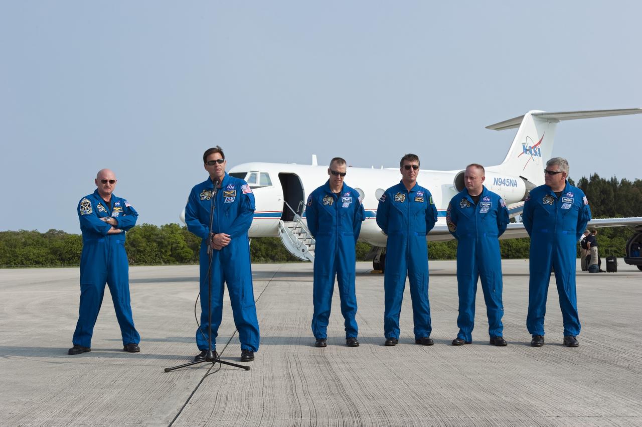 CAPE CANAVERAL, Fla. -- The STS-134 crew members arrived on the Shuttle Landing Facility at NASA's Kennedy Space Center in Florida at about 9 a.m. EDT to get ready for space shuttle Endeavour's launch to the International Space Station scheduled for Monday, May 16 at 8:56 a.m. From left are Commander Mark Kelly, Mission Specialists Greg Chamitoff, at the microphone, Andrew Feustel, European Space Agency astronaut Roberto Vittori, Michael Fincke and Pilot Greg H. Johnson.      Endeavour and its crew will deliver the Express Logistics Carrier-3, Alpha Magnetic Spectrometer-2 (AMS), a high-pressure gas tank and additional spare parts for the Dextre robotic helper to the station. This will be the final spaceflight for Endeavour. For more information visit, www.nasa.gov/mission_pages/shuttle/shuttlemissions/sts134/index.html. Photo credit: NASA/Kim Shiflett