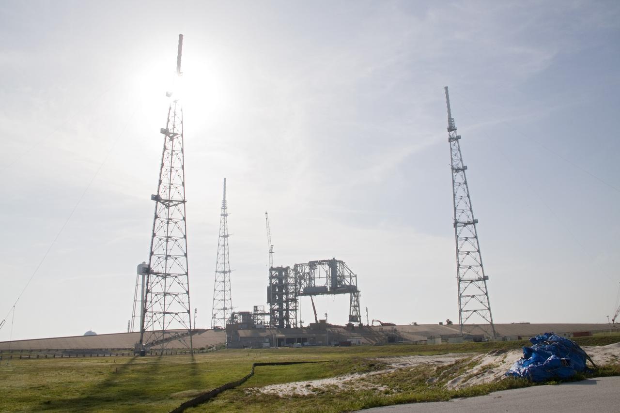 Cape Canaveral, Fla. -- Photographed from the base of the former emergency egress system at NASA's Kennedy Space Center in Florida, is the skeleton of steel that once was Launch Pad 39B after significant deconstruction. The system included seven baskets suspended from seven slidewires that extended from the pad to a landing zone 1,200 feet west of the pad. The bunkers at the base also are being dismantled. In 2009, the pad was no longer needed for the shuttle program, so it is being restructured for future use. Its new design will feature a "clean pad" for rockets to come with their own launcher, making it more versatile for a number of vehicles. The new lightning protection system, which was in place for the October 2009 launch of Ares I-X, will remain. For information on NASA's future plans, visit www.nasa.gov. Photo credit: NASA/Jack Pfaller