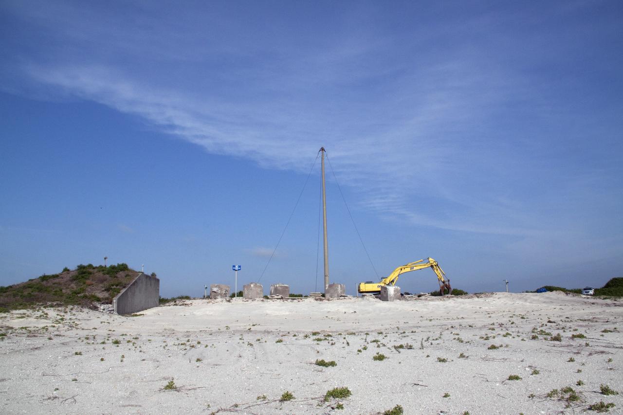 Cape Canaveral, Fla. -- At NASA's Kennedy Space Center in Florida, the emergency egress system that was part of Launch Pad 39B included seven baskets suspended from seven slidewires that extended from the pad to a landing zone 1,200 feet west of the pad. The system and the bunkers at the base also are being dismantled. In 2009, the pad was no longer needed for the shuttle program, so it is being restructured for future use. Its new design will feature a "clean pad" for rockets to come with their own launcher, making it more versatile for a number of vehicles. The new lightning protection system, which was in place for the October 2009 launch of Ares I-X, will remain. For information on NASA's future plans, visit www.nasa.gov. Photo credit: NASA/Jack Pfaller