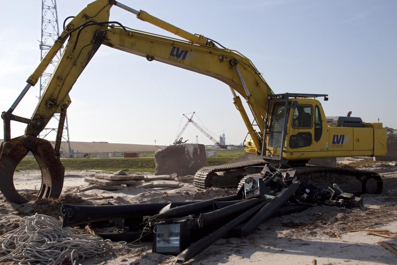 Cape Canaveral, Fla. -- At NASA's Kennedy Space Center in Florida, the emergency egress system that was part of Launch Pad 39B included seven baskets suspended from seven slidewires that extended from the pad to a landing zone 1,200 feet west of the pad. The system and the bunkers at the base also are being dismantled.  In 2009, the pad was no longer needed for the shuttle program, so it is being restructured for future use. Its new design will feature a "clean pad" for rockets to come with their own launcher, making it more versatile for a number of vehicles. The new lightning protection system, which was in place for the October 2009 launch of Ares I-X, will remain. For information on NASA's future plans, visit www.nasa.gov. Photo credit: NASA/Jack Pfaller