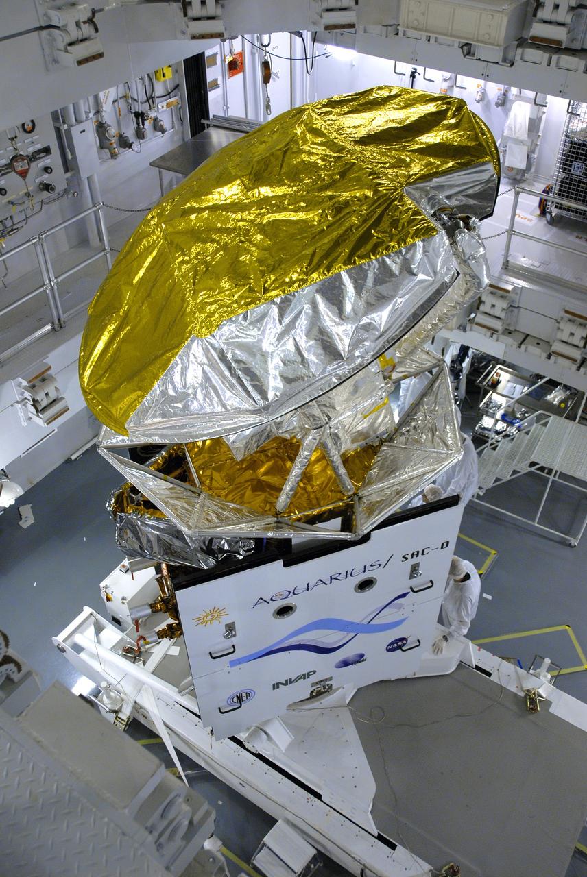 VANDENBERG AIR FORCE BASE, Calif. -- In Space Systems International's Payload Processing Facility at Vandenberg Air Force Base in California, NASA's Aquarius/SAC-D spacecraft is rotated for the final time into a vertical position prior to its installation into a transportation canister.             Following delivery to the launch pad, the spacecraft will be integrated to a United Launch Alliance Delta II rocket in preparation for the targeted June liftoff. Aquarius, the NASA-built primary instrument on the SAC-D spacecraft, will provide new insights into how variations in ocean surface salinity relate to fundamental climate processes on its three-year mission. Photo credit: NASA/VAFB