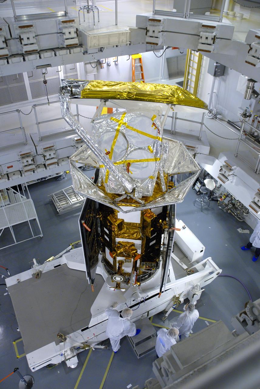 VANDENBERG AIR FORCE BASE, Calif. -- In Space Systems International's Payload Processing Facility at Vandenberg Air Force Base in California, NASA's Aquarius/SAC-D spacecraft is rotated for the final time into a vertical position prior to its installation into a transportation canister.           Following delivery to the launch pad, the spacecraft will be integrated to a United Launch Alliance Delta II rocket in preparation for the targeted June liftoff. Aquarius, the NASA-built primary instrument on the SAC-D spacecraft, will provide new insights into how variations in ocean surface salinity relate to fundamental climate processes on its three-year mission. Photo credit: NASA/VAFB
