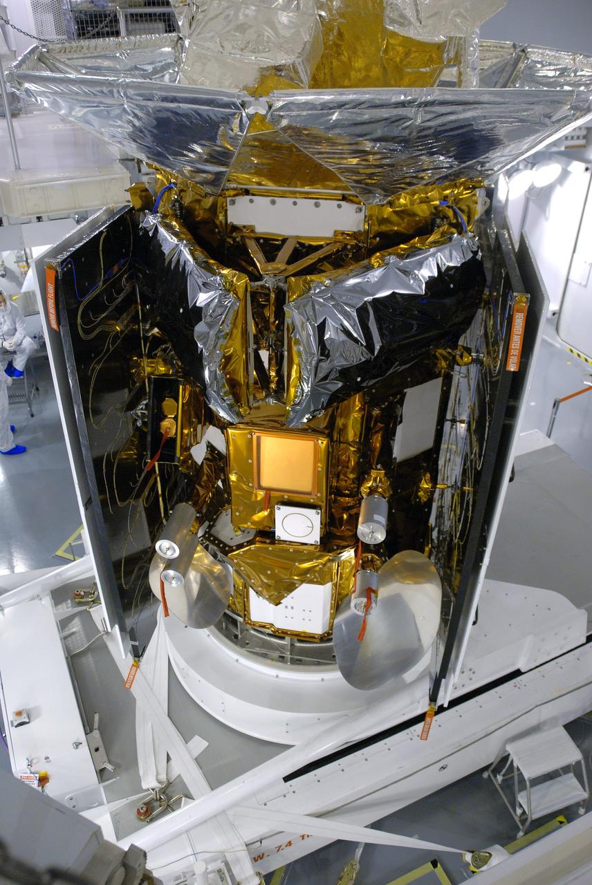 VANDENBERG AIR FORCE BASE, Calif. -- In Space Systems International's Payload Processing Facility at Vandenberg Air Force Base in California, NASA's Aquarius/SAC-D spacecraft is rotated for the final time into a vertical position prior to its installation into a transportation canister.           Following delivery to the launch pad, the spacecraft will be integrated to a United Launch Alliance Delta II rocket in preparation for the targeted June liftoff. Aquarius, the NASA-built primary instrument on the SAC-D spacecraft, will provide new insights into how variations in ocean surface salinity relate to fundamental climate processes on its three-year mission. Photo credit: NASA/VAFB