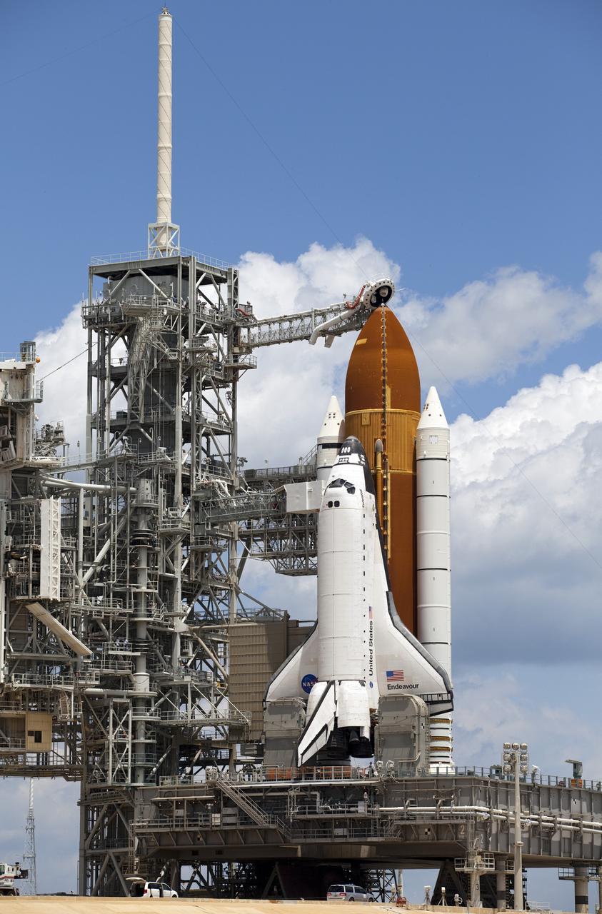 CAPE CANAVERAL, Fla. -- At Launch Pad 39A at NASA's Kennedy Space Center in Florida, the rotating service structure (RSS) is moved away from space shuttle Endeavour in preparation for the shuttle's upcoming launch. Retraction of the structure, which provides weather protection and access to the shuttle, began at 11:44 a.m. EDT and was completed at 12:24 p.m.             RSS "rollback" is a significant milestone in Endeavour's STS-134 mission countdown. Liftoff is scheduled for May 16 at 8:56 a.m. EDT. Endeavour and its crew will deliver the Express Logistics Carrier-3, Alpha Magnetic Spectrometer-2 (AMS), a high-pressure gas tank and additional spare parts for the Dextre robotic helper to the station. This will be the final spaceflight for Endeavour. For more information visit, www.nasa.gov/mission_pages/shuttle/shuttlemissions/sts134/index.html. Photo credit: NASA/Frankie Martin