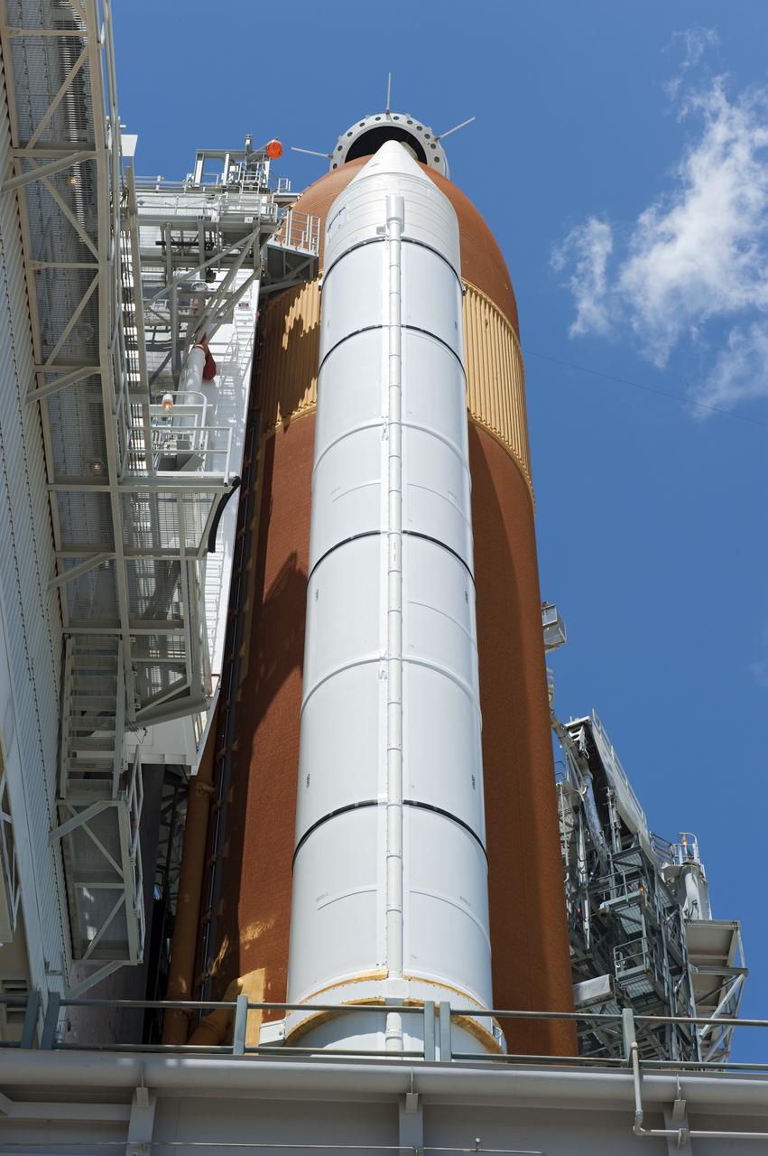 CAPE CANAVERAL, Fla. - At NASA's Kennedy Space Center in Florida, the rotating service structure (RSS) moves away from space shuttle Endeavour on Launch Pad 39A. The structure provides weather protection and access to the shuttle while it awaits lift off on the pad. RSS "rollback," as it's called, began at 11:44 a.m. EDT on May 15 and was completed at 12:24 p.m.         STS-134 will deliver the Alpha Magnetic Spectrometer-2 (AMS), Express Logistics Carrier-3, a high-pressure gas tank and additional spare parts for the Dextre robotic helper to the International Space Station. May 16 at 8:56 a.m. will be the second launch attempt for Endeavour. The first attempt on April 29 was scrubbed because of an issue associated with a faulty power distribution box called the aft load control assembly-2 (ALCA-2). STS-134 will be the final spaceflight for Endeavour. For more information visit, www.nasa.gov/mission_pages/shuttle/shuttlemissions/sts134/index.html. Photo credit: NASA/Kim Shiflett