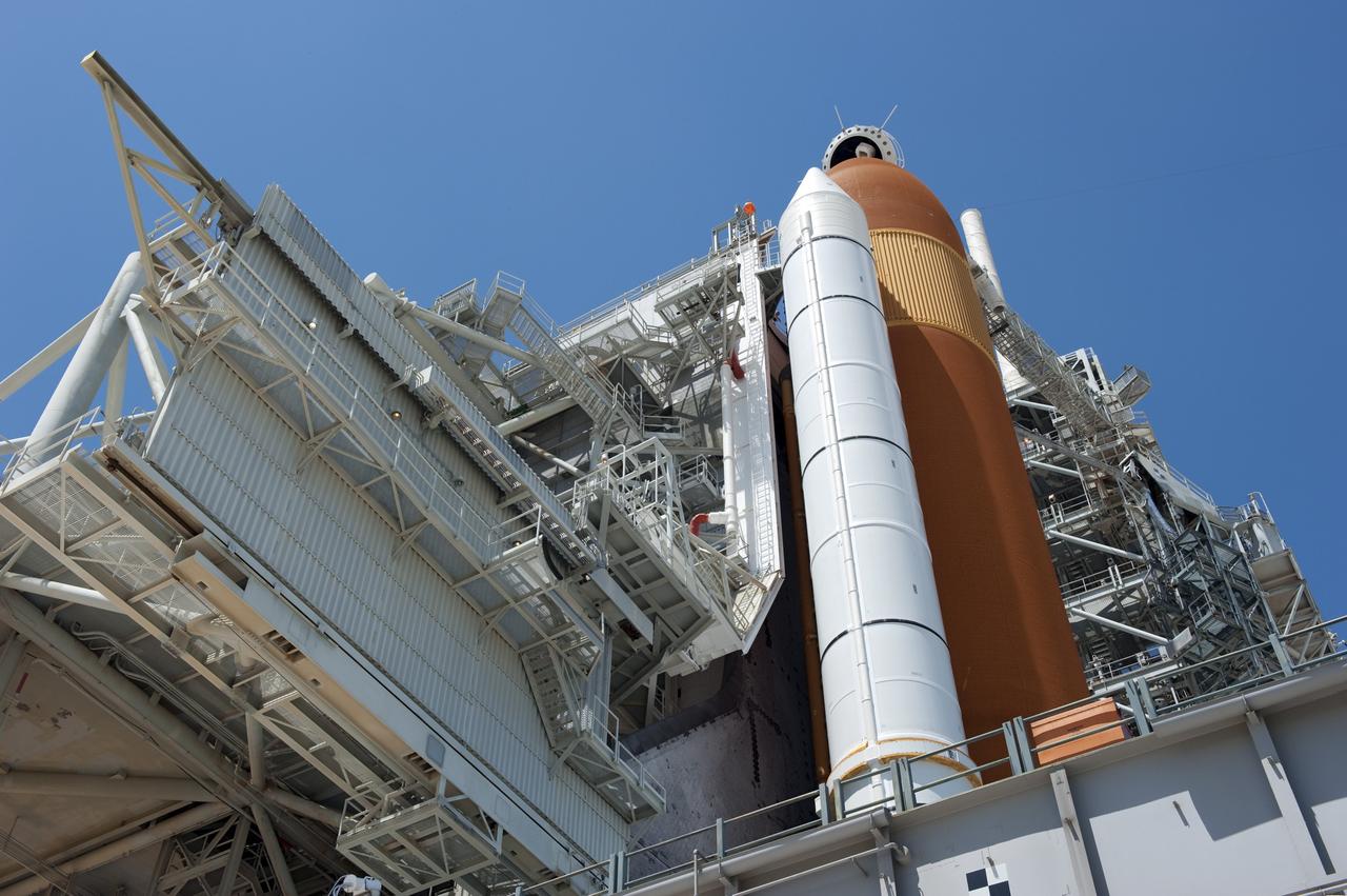 CAPE CANAVERAL, Fla. - At NASA's Kennedy Space Center in Florida, the rotating service structure (RSS) moves away from space shuttle Endeavour on Launch Pad 39A. The structure provides weather protection and access to the shuttle while it awaits lift off on the pad. RSS "rollback," as it's called, began at 11:44 a.m. EDT on May 15 and was completed at 12:24 p.m.       STS-134 will deliver the Alpha Magnetic Spectrometer-2 (AMS), Express Logistics Carrier-3, a high-pressure gas tank and additional spare parts for the Dextre robotic helper to the International Space Station. May 16 at 8:56 a.m. will be the second launch attempt for Endeavour. The first attempt on April 29 was scrubbed because of an issue associated with a faulty power distribution box called the aft load control assembly-2 (ALCA-2). STS-134 will be the final spaceflight for Endeavour. For more information visit, www.nasa.gov/mission_pages/shuttle/shuttlemissions/sts134/index.html. Photo credit: NASA/Kim Shiflett