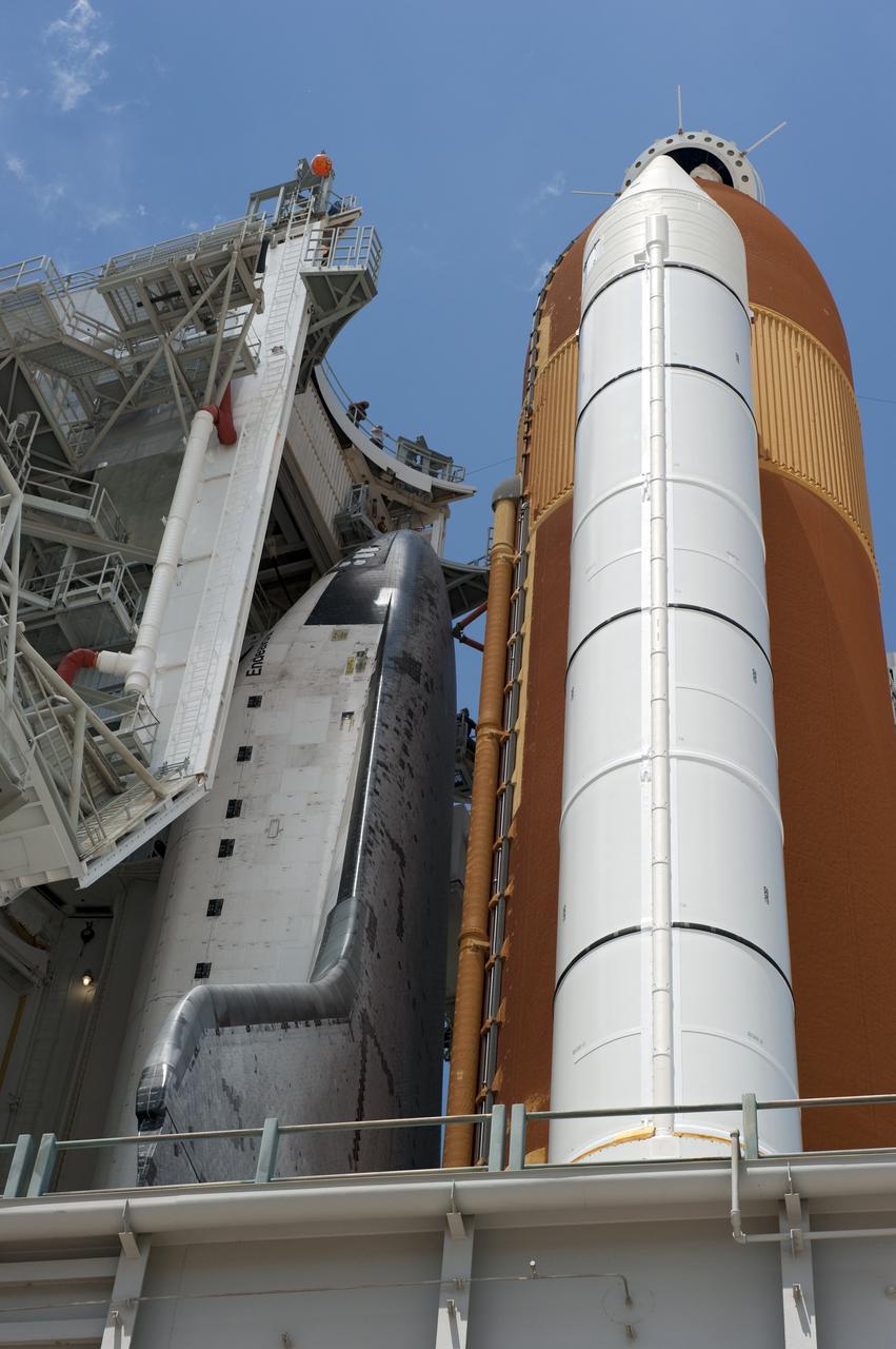 CAPE CANAVERAL, Fla. - At NASA's Kennedy Space Center in Florida, the rotating service structure (RSS) moves away from space shuttle Endeavour on Launch Pad 39A. The structure provides weather protection and access to the shuttle while it awaits lift off on the pad. RSS "rollback," as it's called, began at 11:44 a.m. EDT on May 15 and was completed at 12:24 p.m.     STS-134 will deliver the Alpha Magnetic Spectrometer-2 (AMS), Express Logistics Carrier-3, a high-pressure gas tank and additional spare parts for the Dextre robotic helper to the International Space Station. May 16 at 8:56 a.m. will be the second launch attempt for Endeavour. The first attempt on April 29 was scrubbed because of an issue associated with a faulty power distribution box called the aft load control assembly-2 (ALCA-2). STS-134 will be the final spaceflight for Endeavour. For more information visit, www.nasa.gov/mission_pages/shuttle/shuttlemissions/sts134/index.html. Photo credit: NASA/Kim Shiflett