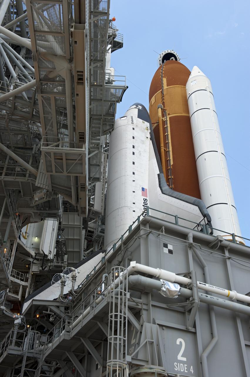 CAPE CANAVERAL, Fla. - At NASA's Kennedy Space Center in Florida, the rotating service structure (RSS) moves away from space shuttle Endeavour on Launch Pad 39A. The structure provides weather protection and access to the shuttle while it awaits lift off on the pad. RSS "rollback," as it's called, began at 11:44 a.m. EDT on May 15 and was completed at 12:24 p.m.             STS-134 will deliver the Alpha Magnetic Spectrometer-2 (AMS), Express Logistics Carrier-3, a high-pressure gas tank and additional spare parts for the Dextre robotic helper to the International Space Station. May 16 at 8:56 a.m. will be the second launch attempt for Endeavour. The first attempt on April 29 was scrubbed because of an issue associated with a faulty power distribution box called the aft load control assembly-2 (ALCA-2). STS-134 will be the final spaceflight for Endeavour. For more information visit, www.nasa.gov/mission_pages/shuttle/shuttlemissions/sts134/index.html. Photo credit: NASA/Kim Shiflett
