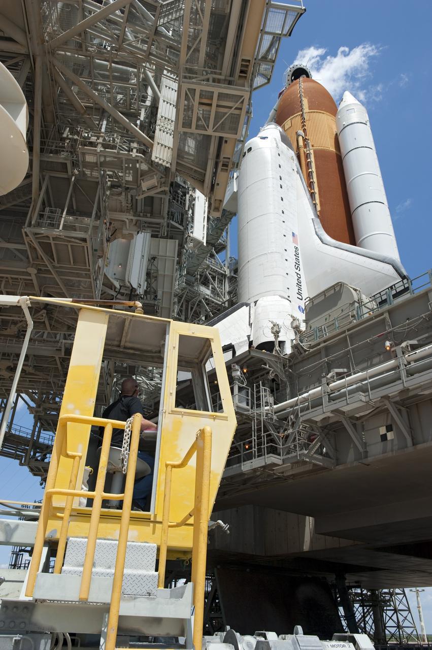 CAPE CANAVERAL, Fla. - At NASA's Kennedy Space Center in Florida, the rotating service structure (RSS) moves away from space shuttle Endeavour on Launch Pad 39A. The structure provides weather protection and access to the shuttle while it awaits lift off on the pad. RSS "rollback," as it's called, began at 11:44 a.m. EDT on May 15 and was completed at 12:24 p.m.           STS-134 will deliver the Alpha Magnetic Spectrometer-2 (AMS), Express Logistics Carrier-3, a high-pressure gas tank and additional spare parts for the Dextre robotic helper to the International Space Station. May 16 at 8:56 a.m. will be the second launch attempt for Endeavour. The first attempt on April 29 was scrubbed because of an issue associated with a faulty power distribution box called the aft load control assembly-2 (ALCA-2). STS-134 will be the final spaceflight for Endeavour. For more information visit, www.nasa.gov/mission_pages/shuttle/shuttlemissions/sts134/index.html. Photo credit: NASA/Kim Shiflett