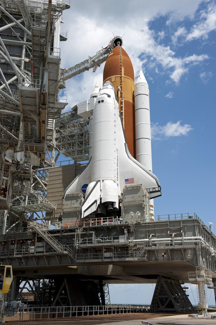 CAPE CANAVERAL, Fla. - At NASA's Kennedy Space Center in Florida, the rotating service structure (RSS) moves away from space shuttle Endeavour on Launch Pad 39A. The structure provides weather protection and access to the shuttle while it awaits lift off on the pad. RSS "rollback," as it's called, began at 11:44 a.m. EDT on May 15 and was completed at 12:24 p.m.     STS-134 will deliver the Alpha Magnetic Spectrometer-2 (AMS), Express Logistics Carrier-3, a high-pressure gas tank and additional spare parts for the Dextre robotic helper to the International Space Station. May 16 at 8:56 a.m. will be the second launch attempt for Endeavour. The first attempt on April 29 was scrubbed because of an issue associated with a faulty power distribution box called the aft load control assembly-2 (ALCA-2). STS-134 will be the final spaceflight for Endeavour. For more information visit, www.nasa.gov/mission_pages/shuttle/shuttlemissions/sts134/index.html. Photo credit: NASA/Kim Shiflett