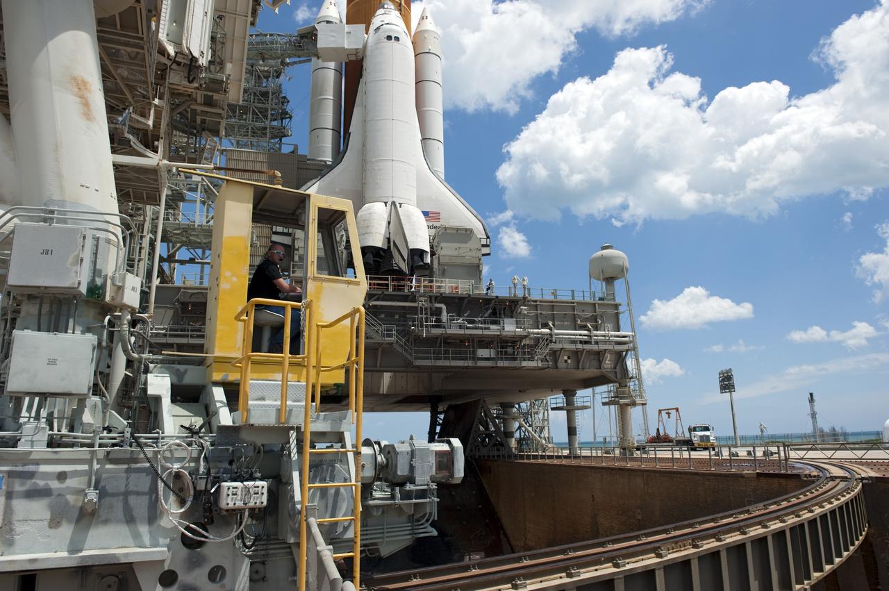 CAPE CANAVERAL, Fla. - At NASA's Kennedy Space Center in Florida, the rotating service structure (RSS) moves away from space shuttle Endeavour on Launch Pad 39A. The structure provides weather protection and access to the shuttle while it awaits lift off on the pad. RSS "rollback," as it's called, began at 11:44 a.m. EDT on May 15 and was completed at 12:24 p.m.           STS-134 will deliver the Alpha Magnetic Spectrometer-2 (AMS), Express Logistics Carrier-3, a high-pressure gas tank and additional spare parts for the Dextre robotic helper to the International Space Station. May 16 at 8:56 a.m. will be the second launch attempt for Endeavour. The first attempt on April 29 was scrubbed because of an issue associated with a faulty power distribution box called the aft load control assembly-2 (ALCA-2). STS-134 will be the final spaceflight for Endeavour. For more information visit, www.nasa.gov/mission_pages/shuttle/shuttlemissions/sts134/index.html. Photo credit: NASA/Kim Shiflett
