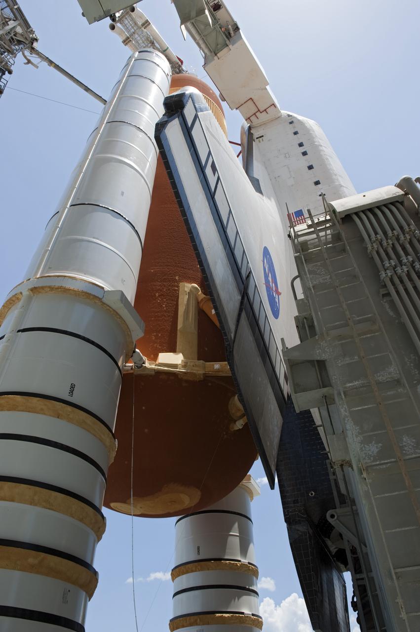 CAPE CANAVERAL, Fla. - Backdropped by a beautiful blue sky and the crystal-clear Atlantic Ocean, space shuttle Endeavour is revealed on Launch Pad 39A at NASA's Kennedy Space Center in Florida following the move of the rotating service structure (RSS). The structure provides weather protection and access to the shuttle while it awaits lift off on the pad. RSS "rollback," as it's called, began at 11:44 a.m. EDT on May 15 and was completed at 12:24 p.m.         STS-134 will deliver the Alpha Magnetic Spectrometer-2 (AMS), Express Logistics Carrier-3, a high-pressure gas tank and additional spare parts for the Dextre robotic helper to the International Space Station. May 16 at 8:56 a.m. will be the second launch attempt for Endeavour. The first attempt on April 29 was scrubbed because of an issue associated with a faulty power distribution box called the aft load control assembly-2 (ALCA-2). STS-134 will be the final spaceflight for Endeavour. For more information visit, www.nasa.gov/mission_pages/shuttle/shuttlemissions/sts134/index.html. Photo credit: NASA/Kim Shiflett