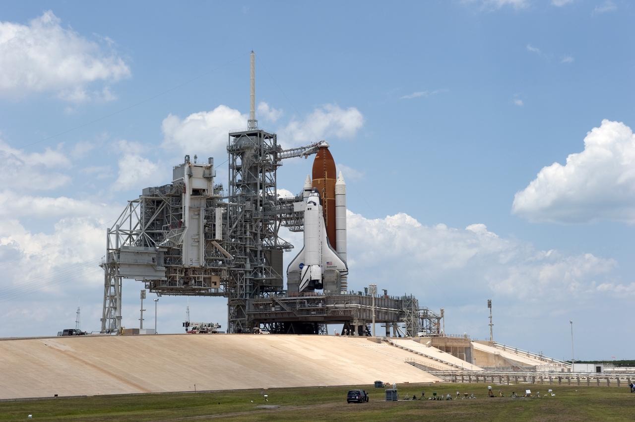CAPE CANAVERAL, Fla. -- At NASA's Kennedy Space Center in Florida, space shuttle Endeavour stands majestically on Launch Pad 39A, totally revealed after the rotating service structure (RSS) was rolled away in preparation for the shuttle's upcoming launch. Retraction of the structure, which provides weather protection and access to the shuttle, began at 11:44 a.m. EDT and was completed at 12:24 p.m.            RSS "rollback" marks a major milestone in Endeavour's STS-134 mission countdown. Liftoff is scheduled for May 16 at 8:56 a.m. EDT. Endeavour and its crew will deliver the Express Logistics Carrier-3, Alpha Magnetic Spectrometer-2 (AMS), a high-pressure gas tank and additional spare parts for the Dextre robotic helper to the station. This will be the final spaceflight for Endeavour. For more information visit, www.nasa.gov/mission_pages/shuttle/shuttlemissions/sts134/index.html. Photo credit: NASA/Kim Shiflett