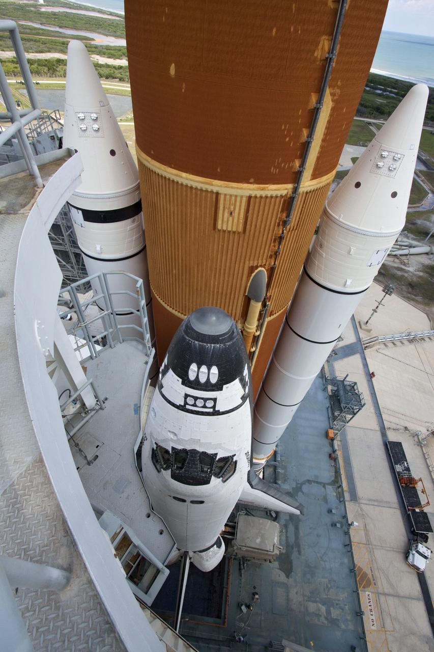 CAPE CANAVERAL, Fla. - At NASA's Kennedy Space Center in Florida, the rotating service structure (RSS) moves away from space shuttle Endeavour on Launch Pad 39A. The structure provides weather protection and access to the shuttle while it awaits lift off on the pad. RSS "rollback," as it's called, began at 11:44 a.m. EDT on May 15 and was completed at 12:24 p.m.           STS-134 will deliver the Alpha Magnetic Spectrometer-2 (AMS), Express Logistics Carrier-3, a high-pressure gas tank and additional spare parts for the Dextre robotic helper to the International Space Station. May 16 at 8:56 a.m. will be the second launch attempt for Endeavour. The first attempt on April 29 was scrubbed because of an issue associated with a faulty power distribution box called the aft load control assembly-2 (ALCA-2). STS-134 will be the final spaceflight for Endeavour. For more information visit, www.nasa.gov/mission_pages/shuttle/shuttlemissions/sts134/index.html. Photo credit: NASA/Jack Pfaller