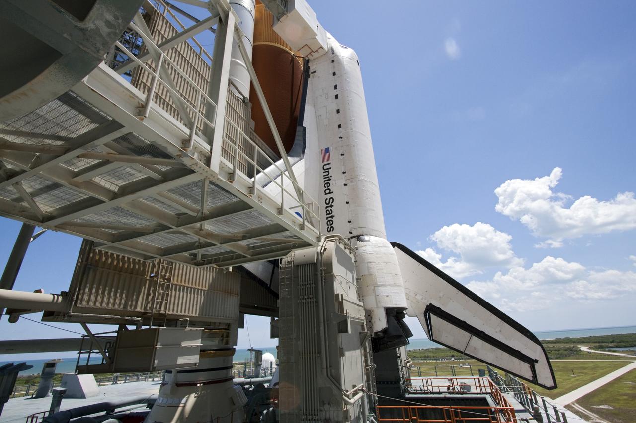 CAPE CANAVERAL, Fla. - Backdropped by a beautiful blue sky and the crystal-clear Atlantic Ocean, space shuttle Endeavour is revealed on Launch Pad 39A at NASA's Kennedy Space Center in Florida as the rotating service structure (RSS) moves away. The structure provides weather protection and access to the shuttle while it awaits lift off on the pad. RSS "rollback," as it's called, began at 11:44 a.m. EDT on May 15 and was completed at 12:24 p.m.         STS-134 will deliver the Alpha Magnetic Spectrometer-2 (AMS), Express Logistics Carrier-3, a high-pressure gas tank and additional spare parts for the Dextre robotic helper to the International Space Station. May 16 at 8:56 a.m. will be the second launch attempt for Endeavour. The first attempt on April 29 was scrubbed because of an issue associated with a faulty power distribution box called the aft load control assembly-2 (ALCA-2). STS-134 will be the final spaceflight for Endeavour. For more information visit, www.nasa.gov/mission_pages/shuttle/shuttlemissions/sts134/index.html. Photo credit: NASA/Jack Pfaller