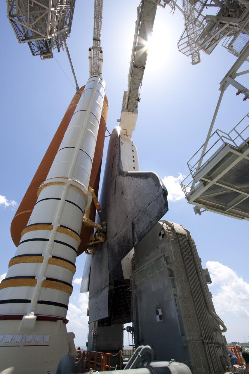 CAPE CANAVERAL, Fla. - The giant external fuel tank and twin solid rocket boosters attached to space shuttle Endeavour bask in the sunlight as the rotating service structure (RSS) moves away on Launch Pad 39A at NASA's Kennedy Space Center in Florida. The structure provides weather protection and access to the shuttle while it awaits lift off on the pad. RSS "rollback," as it's called, began at 11:44 a.m. EDT on May 15 and was completed at 12:24 p.m.       STS-134 will deliver the Alpha Magnetic Spectrometer-2 (AMS), Express Logistics Carrier-3, a high-pressure gas tank and additional spare parts for the Dextre robotic helper to the International Space Station. May 16 at 8:56 a.m. will be the second launch attempt for Endeavour. The first attempt on April 29 was scrubbed because of an issue associated with a faulty power distribution box called the aft load control assembly-2 (ALCA-2). STS-134 will be the final spaceflight for Endeavour. For more information visit, www.nasa.gov/mission_pages/shuttle/shuttlemissions/sts134/index.html. Photo credit: NASA/Jack Pfaller