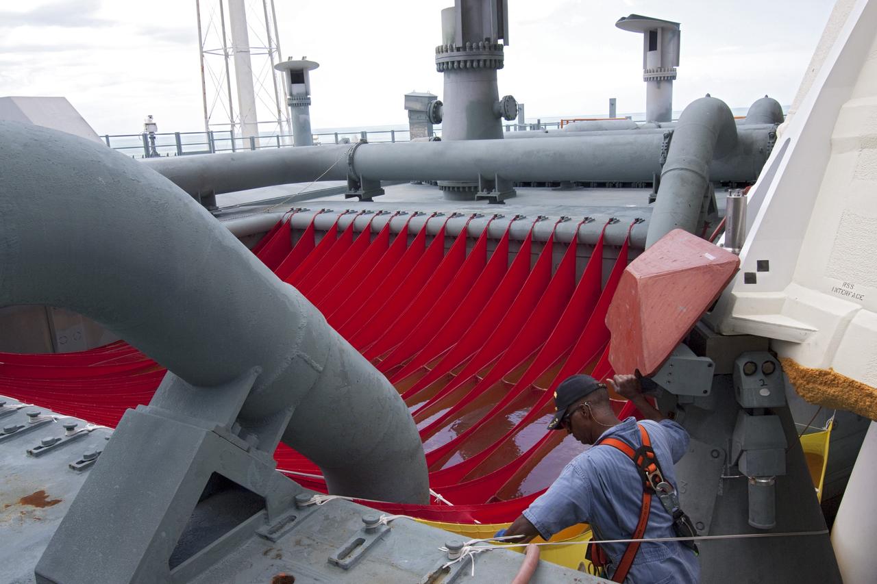 CAPE CANAVERAL, Fla. - Water bags, called red water sausages, are revealed on Launch Pad 39A at NASA's Kennedy Space Center in Florida following the move of the rotating service structure (RSS). RSS "rollback," as it's called, began at 11:44 a.m. EDT on May 15 and was completed at 12:24 p.m. The bags will dampen the wave of sound energy that is reflected back up toward space shuttle Endeavour when the solid rocket boosters ignite during launch. They suppress the powerful pulse of pressure to prevent dangerous stress on the wings of the shuttle.       STS-134 will deliver the Alpha Magnetic Spectrometer-2 (AMS), Express Logistics Carrier-3, a high-pressure gas tank and additional spare parts for the Dextre robotic helper to the International Space Station. May 16 at 8:56 a.m. will be the second launch attempt for Endeavour. The first attempt on April 29 was scrubbed because of an issue associated with a faulty power distribution box called the aft load control assembly-2 (ALCA-2). STS-134 will be the final spaceflight for Endeavour. For more information visit, www.nasa.gov/mission_pages/shuttle/shuttlemissions/sts134/index.html. Photo credit: NASA/Jack Pfaller