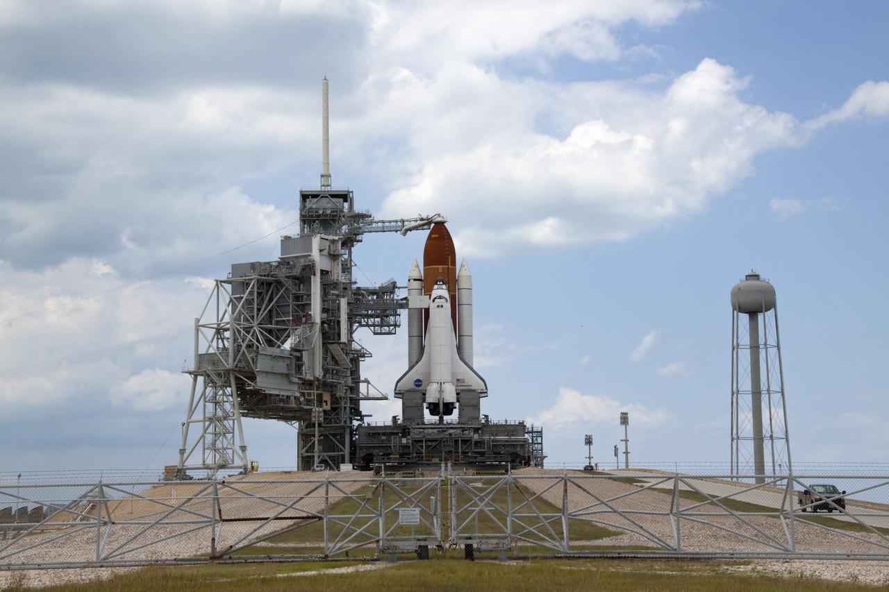 CAPE CANAVERAL, Fla. - At NASA's Kennedy Space Center in Florida, space shuttle Endeavour is revealed on Launch Pad 39A at NASA's Kennedy Space Center in Florida following the move of the rotating service structure (RSS). The structure provides weather protection and access to the shuttle while it awaits lift off on the pad. RSS "rollback," as it's called, began at 11:44 a.m. EDT on May 15 and was complete at 12:24 p.m.     STS-134 will deliver the Alpha Magnetic Spectrometer-2 (AMS), Express Logistics Carrier-3, a high-pressure gas tank and additional spare parts for the Dextre robotic helper to the International Space Station. May 16 at 8:56 a.m. will be the second launch attempt for Endeavour. The first attempt on April 29 was scrubbed because of an issue associated with a faulty power distribution box called the aft load control assembly-2 (ALCA-2). STS-134 will be the final spaceflight for Endeavour. For more information visit, www.nasa.gov/mission_pages/shuttle/shuttlemissions/sts134/index.html. Photo credit: NASA/Jack Pfaller