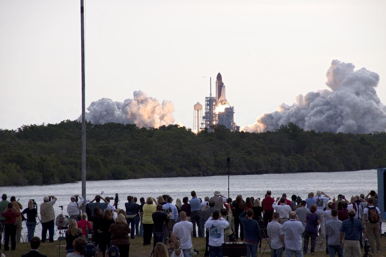 CAPE CANAVERAL, Fla. -- Media capture the launch of space shuttle Endeavour on the STS-134 mission to the International Space Station from the Press Site at NASA's Kennedy Space Center in Florida. The shuttle and its six-member crew lifted off on time at 8:56 a.m. EDT on May 16.        STS-134 will deliver the Alpha Magnetic Spectrometer-2 (AMS), Express Logistics Carrier-3, a high-pressure gas tank and additional spare parts for the Dextre robotic helper to the International Space Station. Endeavour's first launch attempt on April 29 was scrubbed because of an issue associated with a faulty power distribution box called the aft load control assembly-2 (ALCA-2). STS-134 will be the final spaceflight for Endeavour. For more information visit, www.nasa.gov/mission_pages/shuttle/shuttlemissions/sts134/index.html. Photo credit: NASA/Troy Cryder