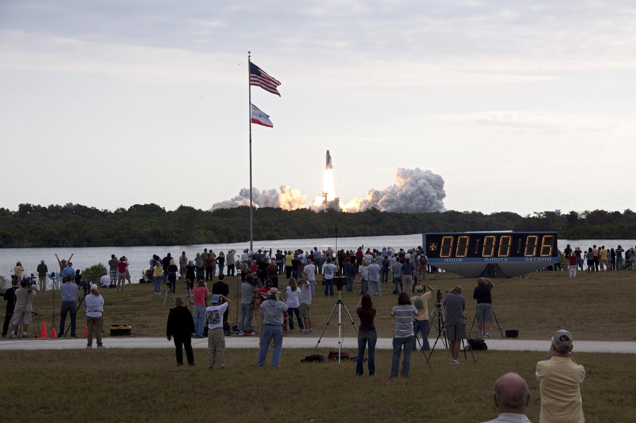 CAPE CANAVERAL, Fla. -- The American flag sways in the breeze as space shuttle Endeavour launches on the STS-134 mission to the International Space Station. The shuttle and its six-member crew lifted off from Launch Pad 39A at NASA's Kennedy Space Center in Florida on time at 8:56 a.m. EDT on May 16.      STS-134 will deliver the Alpha Magnetic Spectrometer-2 (AMS), Express Logistics Carrier-3, a high-pressure gas tank and additional spare parts for the Dextre robotic helper to the International Space Station. Endeavour's first launch attempt on April 29 was scrubbed because of an issue associated with a faulty power distribution box called the aft load control assembly-2 (ALCA-2). STS-134 will be the final spaceflight for Endeavour. For more information visit, www.nasa.gov/mission_pages/shuttle/shuttlemissions/sts134/index.html. Photo credit: NASA/Troy Cryder