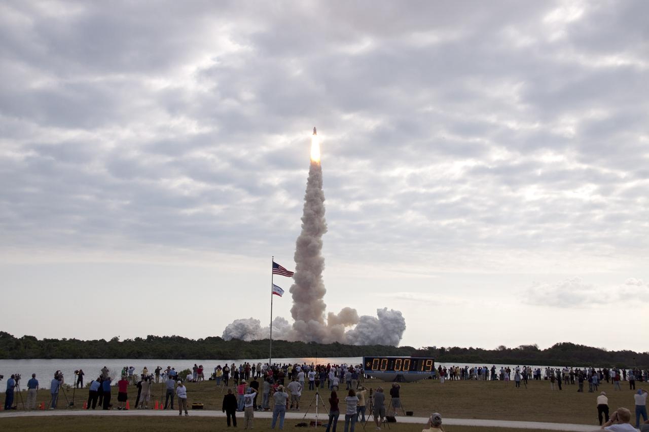 CAPE CANAVERAL, Fla. -- The American flag sways in the breeze as space shuttle Endeavour soars into the sky on the STS-134 mission to the International Space Station. The shuttle and its six-member crew lifted off from Launch Pad 39A at NASA's Kennedy Space Center in Florida on time at 8:56 a.m. EDT on May 16.    STS-134 will deliver the Alpha Magnetic Spectrometer-2 (AMS), Express Logistics Carrier-3, a high-pressure gas tank and additional spare parts for the Dextre robotic helper to the International Space Station. Endeavour's first launch attempt on April 29 was scrubbed because of an issue associated with a faulty power distribution box called the aft load control assembly-2 (ALCA-2). STS-134 will be the final spaceflight for Endeavour. For more information visit, www.nasa.gov/mission_pages/shuttle/shuttlemissions/sts134/index.html. Photo credit: NASA/Troy Cryder