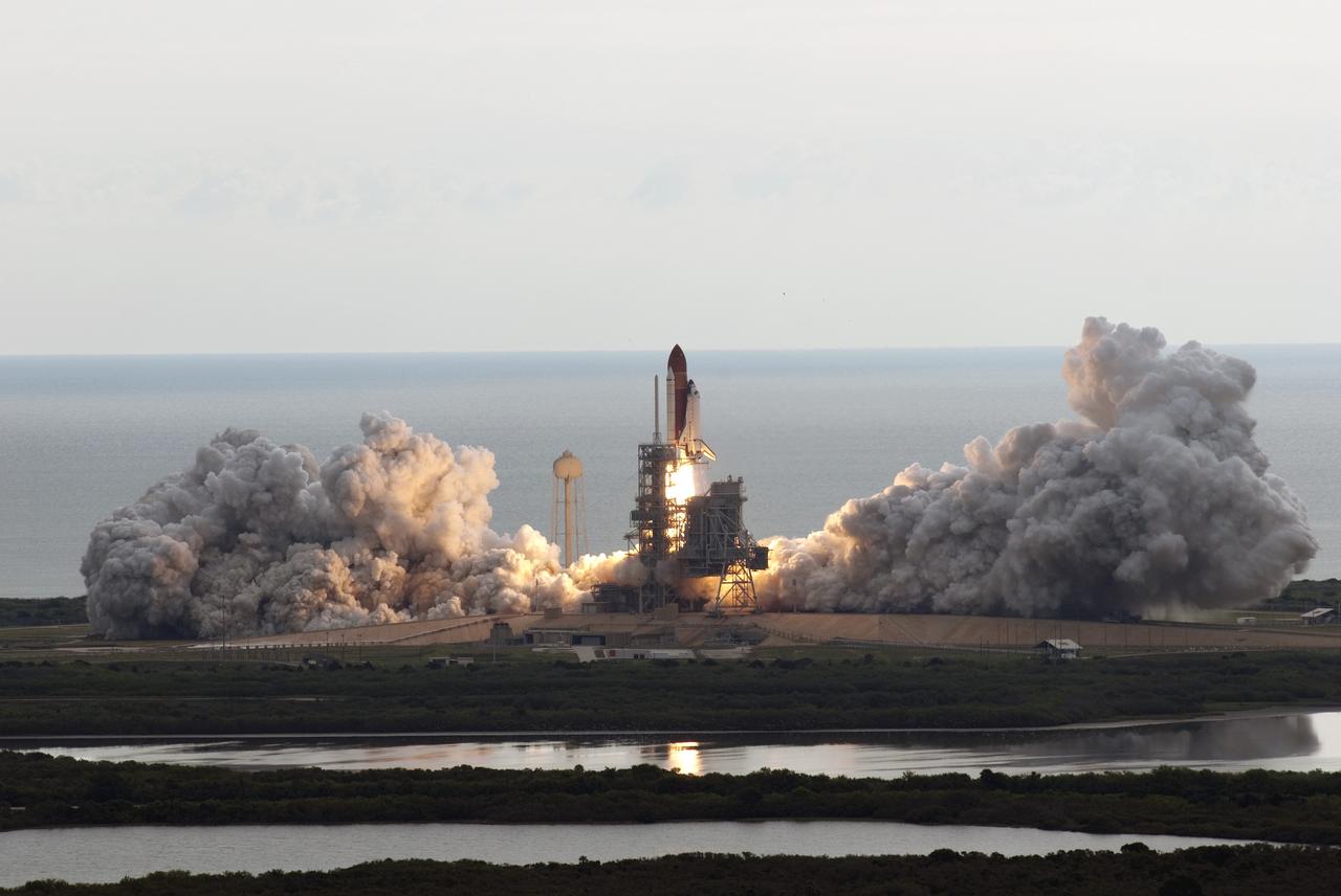 CAPE CANAVERAL, Fla. -- Kicking up a trail of smoke and steam, space shuttle Endeavour lifts off from its seaside launch pad at NASA's Kennedy Space Center in Florida. Endeavour began its final flight, the STS-134 mission, to the International Space Station on time at 8:56 a.m. EDT on May 16.          Endeavour and its six-member crew are embarking on a mission to deliver the Alpha Magnetic Spectrometer-2 (AMS), Express Logistics Carrier-3, a high-pressure gas tank and additional spare parts for the Dextre robotic helper to the space station. Endeavour's first launch attempt on April 29 was scrubbed because of an issue associated with a faulty power distribution box called the aft load control assembly-2 (ALCA-2). For more information visit, www.nasa.gov/mission_pages/shuttle/shuttlemissions/sts134/index.html. Photo credit: NASA/Jim Grossmann