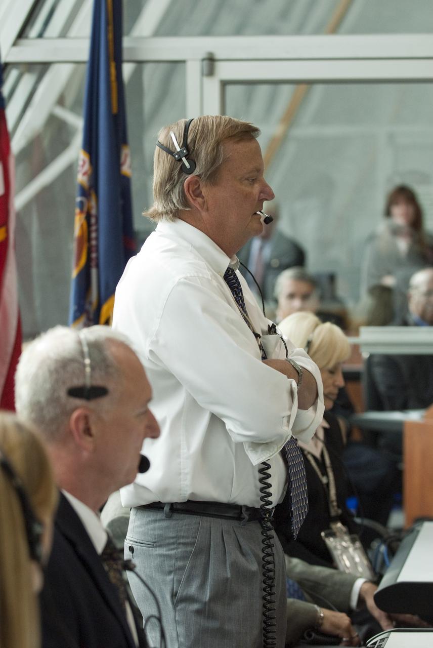CAPE CANAVERAL, Fla. - Shuttle Launch Director Mike Leinbach, standing, and his launch team monitor the countdown to liftoff of space shuttle Endeavour in Firing Room 4 of the Launch Control Center at NASA's Kennedy Space Center in Florida. Endeavour lifted off on its STS-134 mission to the International Space Station on time at 8:56 a.m. EDT on May 16.    The shuttle and its six-member crew are embarking on a mission to deliver the Alpha Magnetic Spectrometer-2 (AMS), Express Logistics Carrier-3, a high-pressure gas tank and additional spare parts for the Dextre robotic helper to the space station. Endeavour's first launch attempt on April 29 was scrubbed because of an issue associated with a faulty power distribution box called the aft load control assembly-2 (ALCA-2). For more information, visit www.nasa.gov/mission_pages/shuttle/shuttlemissions/sts134/index.html. Photo credit: NASA/Kim Shiflett