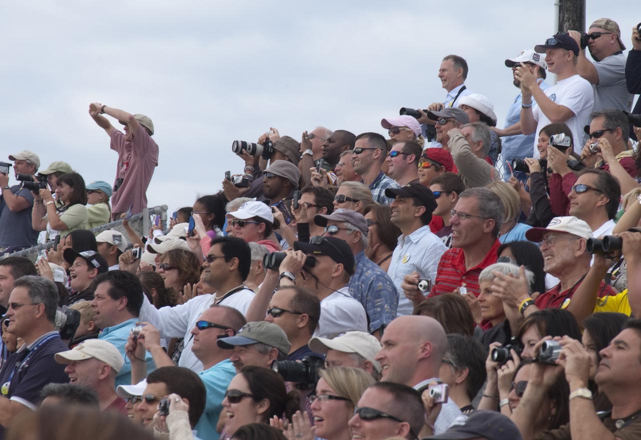 CAPE CANAVERAL, Fla. - Spectators at the Banana Creek Viewing Site near the Saturn V Center at NASA's Kennedy Space Center in Florida watch as space shuttle Endeavour soars skyward. The shuttle lifted off on its STS-134 mission to the International Space Station on time at 8:56 a.m. EDT on May 16.    The shuttle and its six-member crew are embarking on a mission to deliver the Alpha Magnetic Spectrometer-2 (AMS), Express Logistics Carrier-3, a high-pressure gas tank and additional spare parts for the Dextre robotic helper to the space station. Endeavour's first launch attempt on April 29 was scrubbed because of an issue associated with a faulty power distribution box called the aft load control assembly-2 (ALCA-2). For more information, visit www.nasa.gov/mission_pages/shuttle/shuttlemissions/sts134/index.html. Photo credit: NASA/Kurtis Korwan