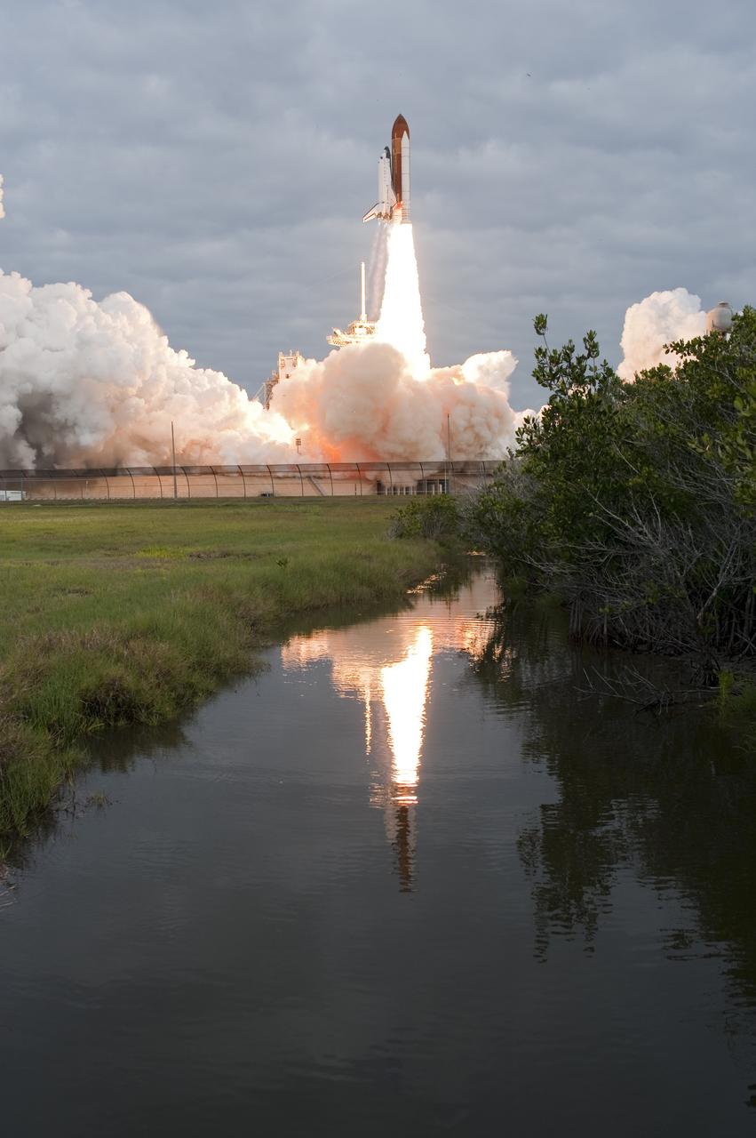 CAPE CANAVERAL, Fla. -- Amid the tranquility of a wildlife refuge, space shuttle Endeavour rumbles off Launch Pad 39A at NASA's Kennedy Space Center in Florida. Endeavour began its final flight, the STS-134 mission, to the International Space Station on time at 8:56 a.m. EDT on May 16.        Endeavour and its six-member crew are embarking on a mission to deliver the Alpha Magnetic Spectrometer-2 (AMS), Express Logistics Carrier-3, a high-pressure gas tank and additional spare parts for the Dextre robotic helper to the space station. Endeavour's first launch attempt on April 29 was scrubbed because of an issue associated with a faulty power distribution box called the aft load control assembly-2 (ALCA-2). For more information visit, www.nasa.gov/mission_pages/shuttle/shuttlemissions/sts134/index.html. Kennedy coexists with the Merritt Island National Wildlife Refuge, habitat to more than 310 species of birds, 25 mammals, 117 fish and 65 amphibians and reptiles. Photo credit: NASA/Tony Gray and Tom Farrar
